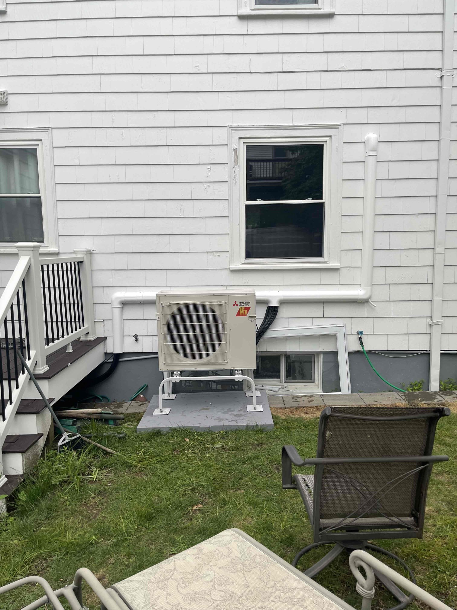 A neat, professionally installed outdoor unit shows Akian Plumbing, Heating, Cooling & Electric delivering dependable HVAC craftsmanship you can trust.