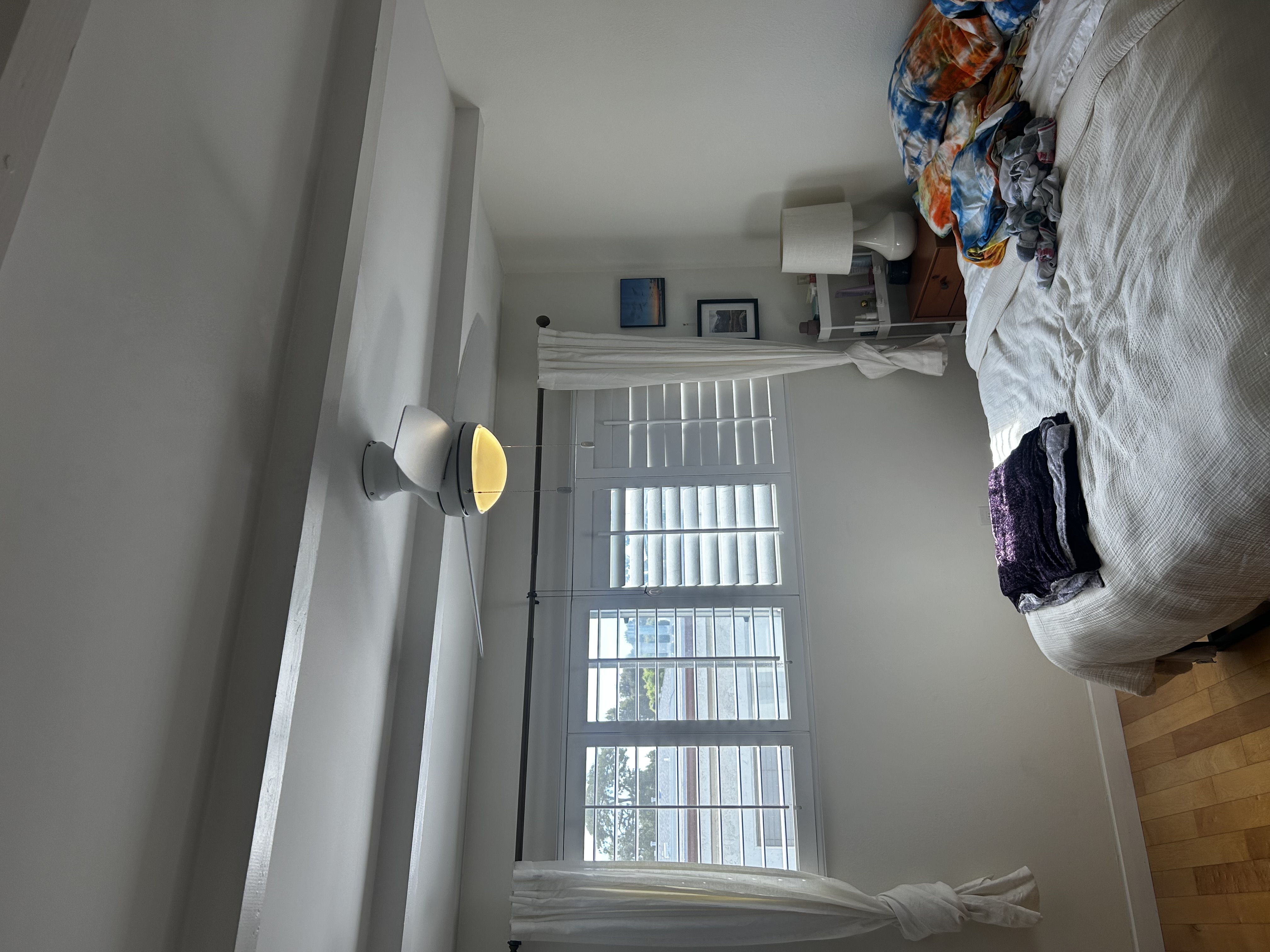 A clean, safe ceiling fan installation brings comfort and reliability to this bedroom, proudly installed by Powell Electric.