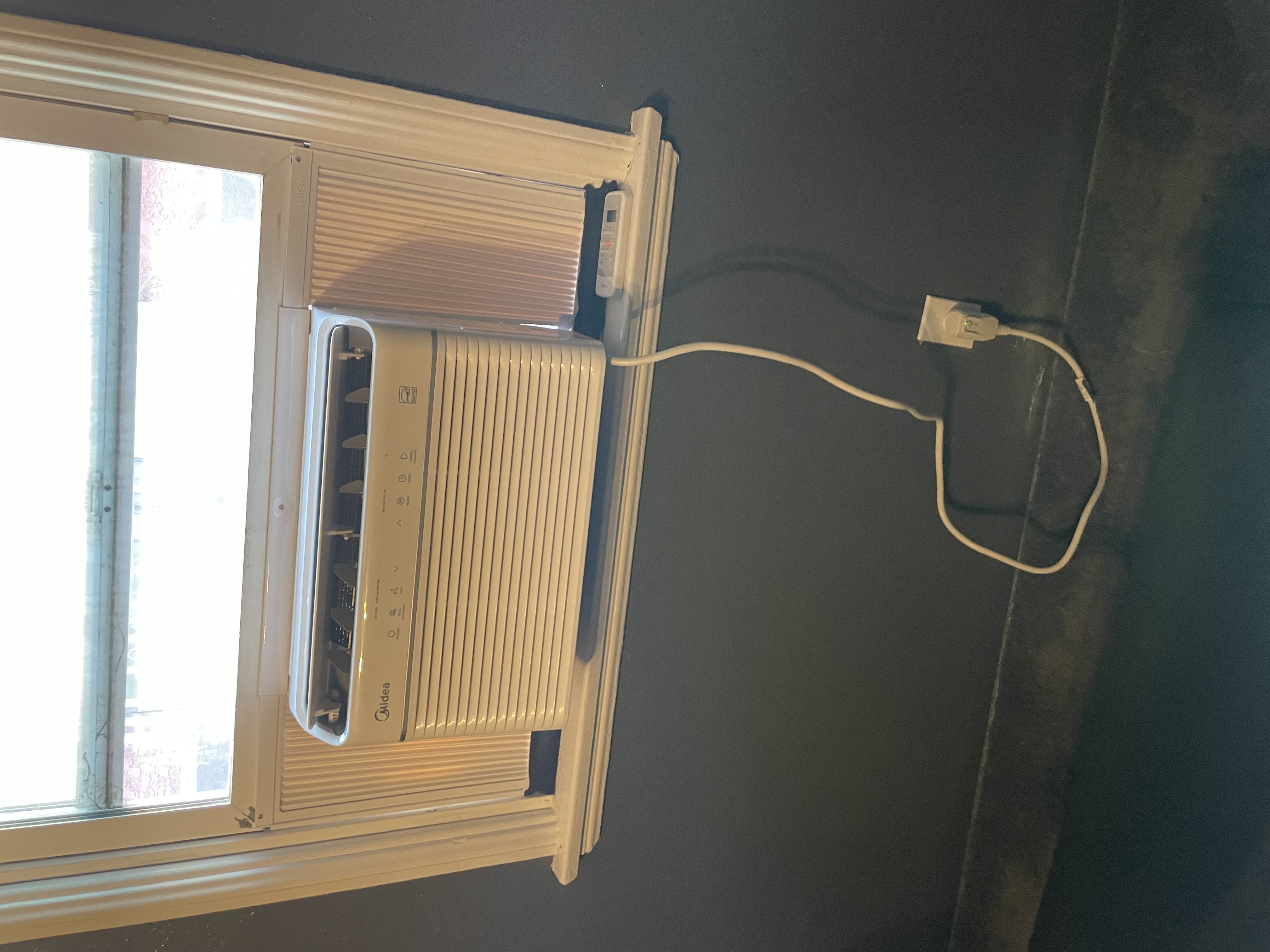 Powell Electric provided a neat window AC installation that highlights reliable workmanship and attention to safe power connections.