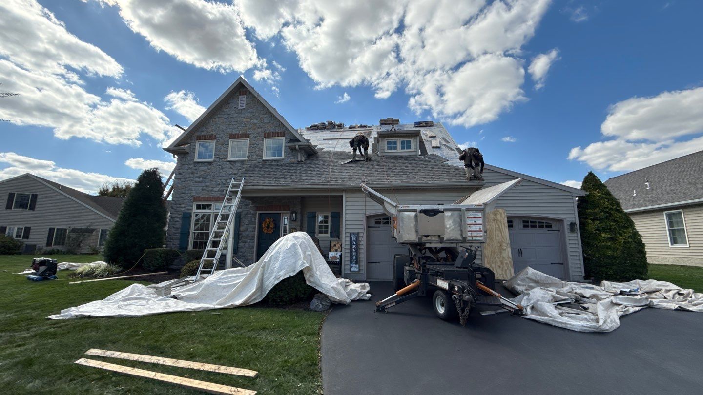 Skilled crews from Mosaic Roofing & Exteriors perform a full roof replacement with care for your home and landscaping throughout the project.