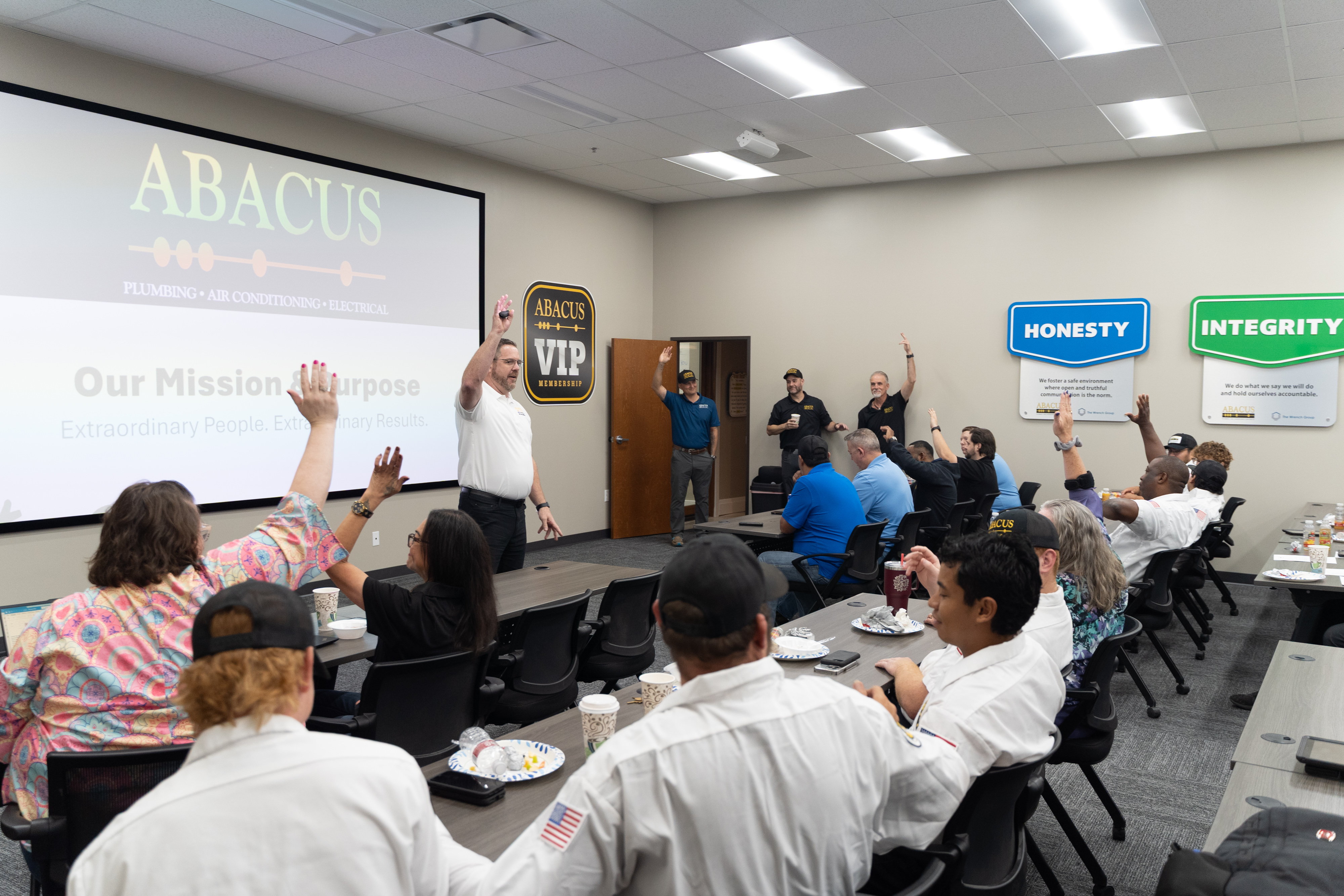 Team engagement and professional training showcase Abacus Plumbing, Air Conditioning, & Electrical commitment to skilled, customer-focused service.