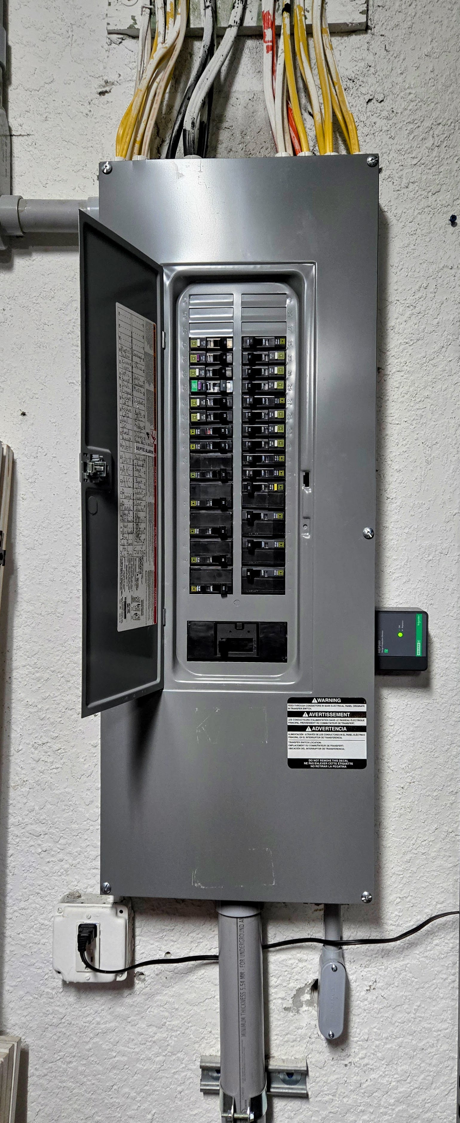 Clean, code-conscious electrical work showcased inside a home with Absolute Electric LLC, emphasizing safety and organized wiring.