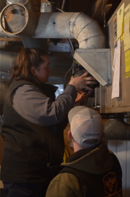Skilled technicians delivering careful furnace service and clear communication, showing the trusted workmanship customers expect from Lloyd Plumbing, Heating, Air, Electrical.