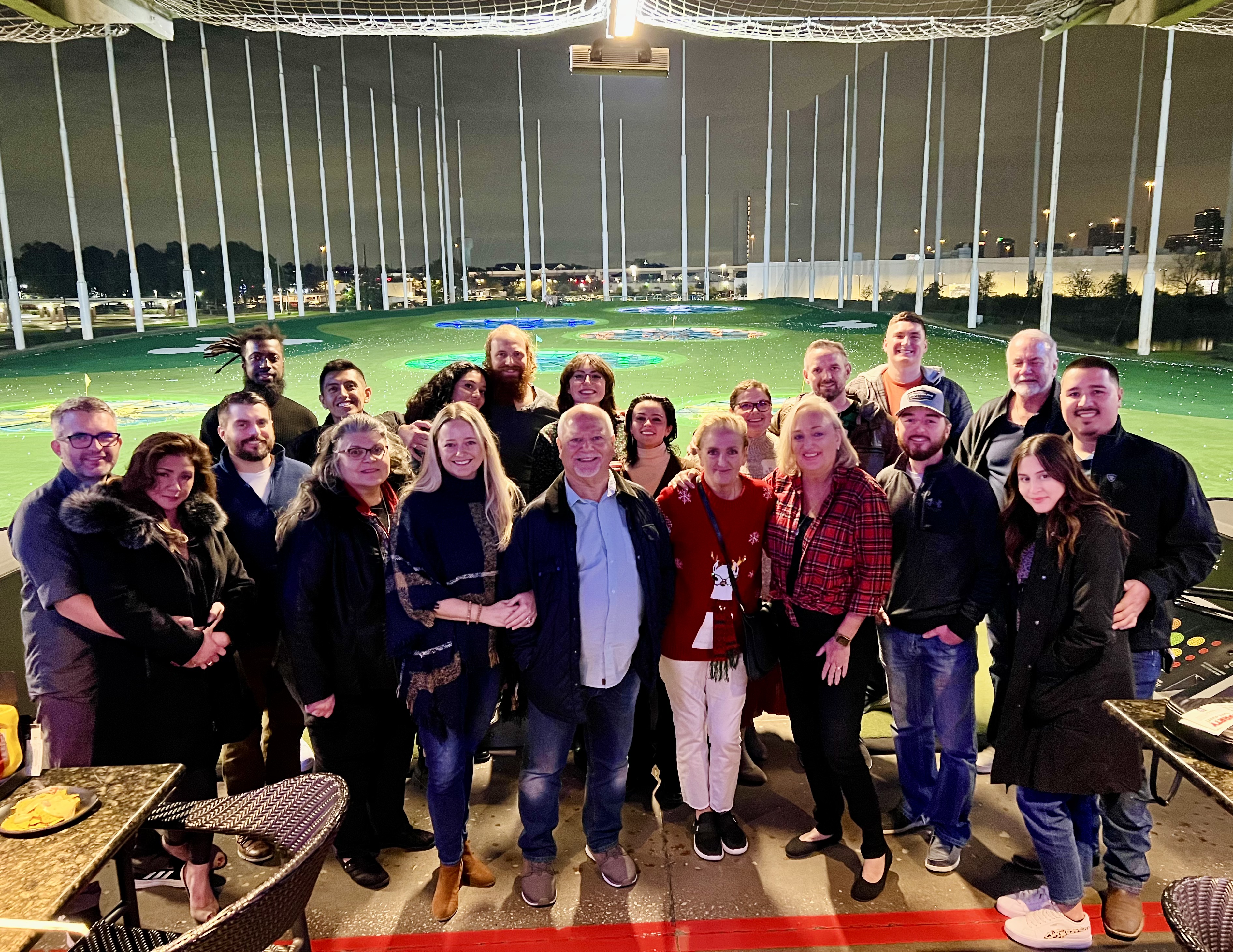 A happy West Houston Electric, Inc. team enjoys a relaxed night out together, showcasing our close-knit culture and trust.
