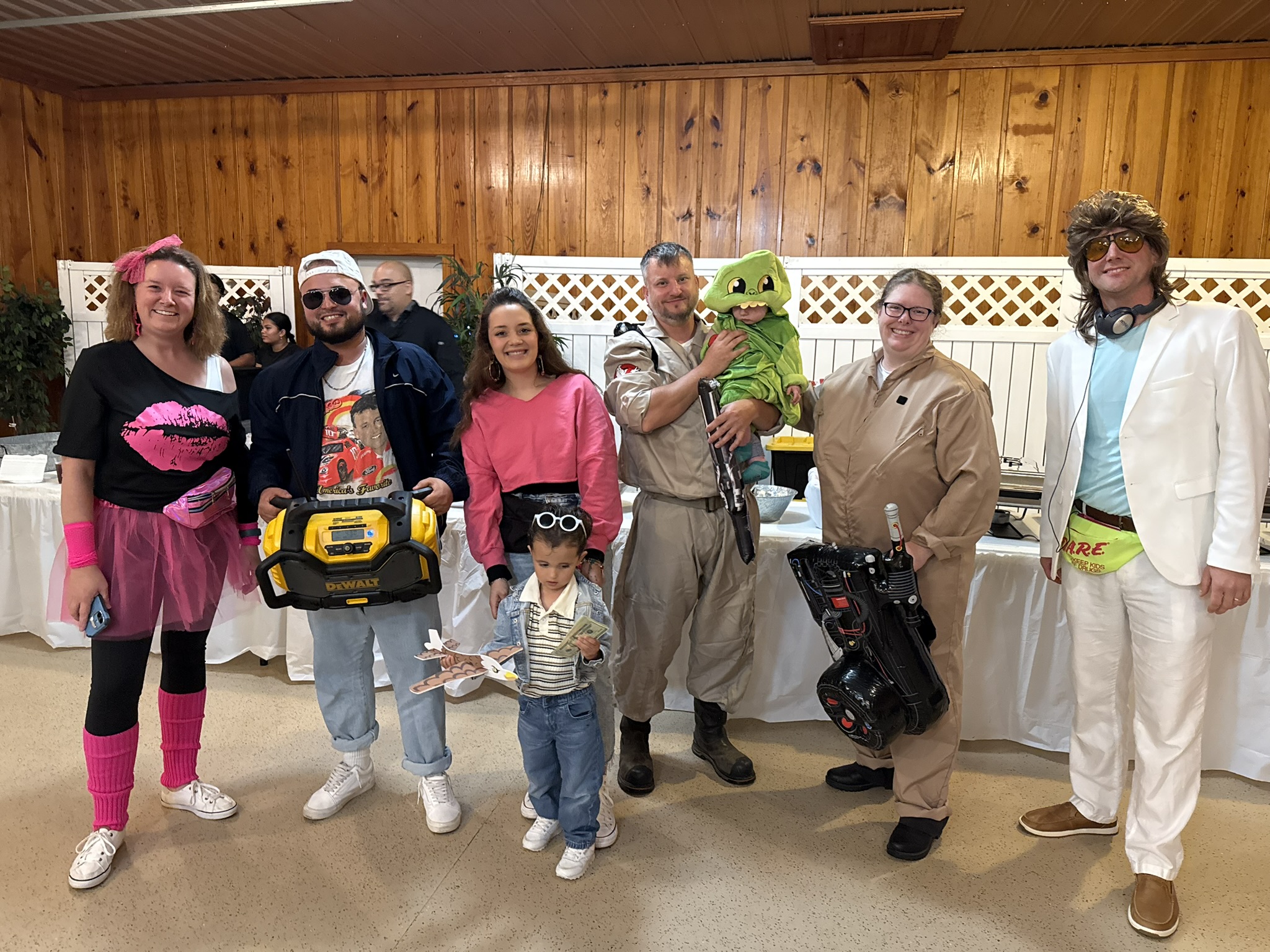 Smiling team members and families at a community event showcase the friendly, approachable service of Advance Mechanical Plumbing, Heating & Air Conditioning.