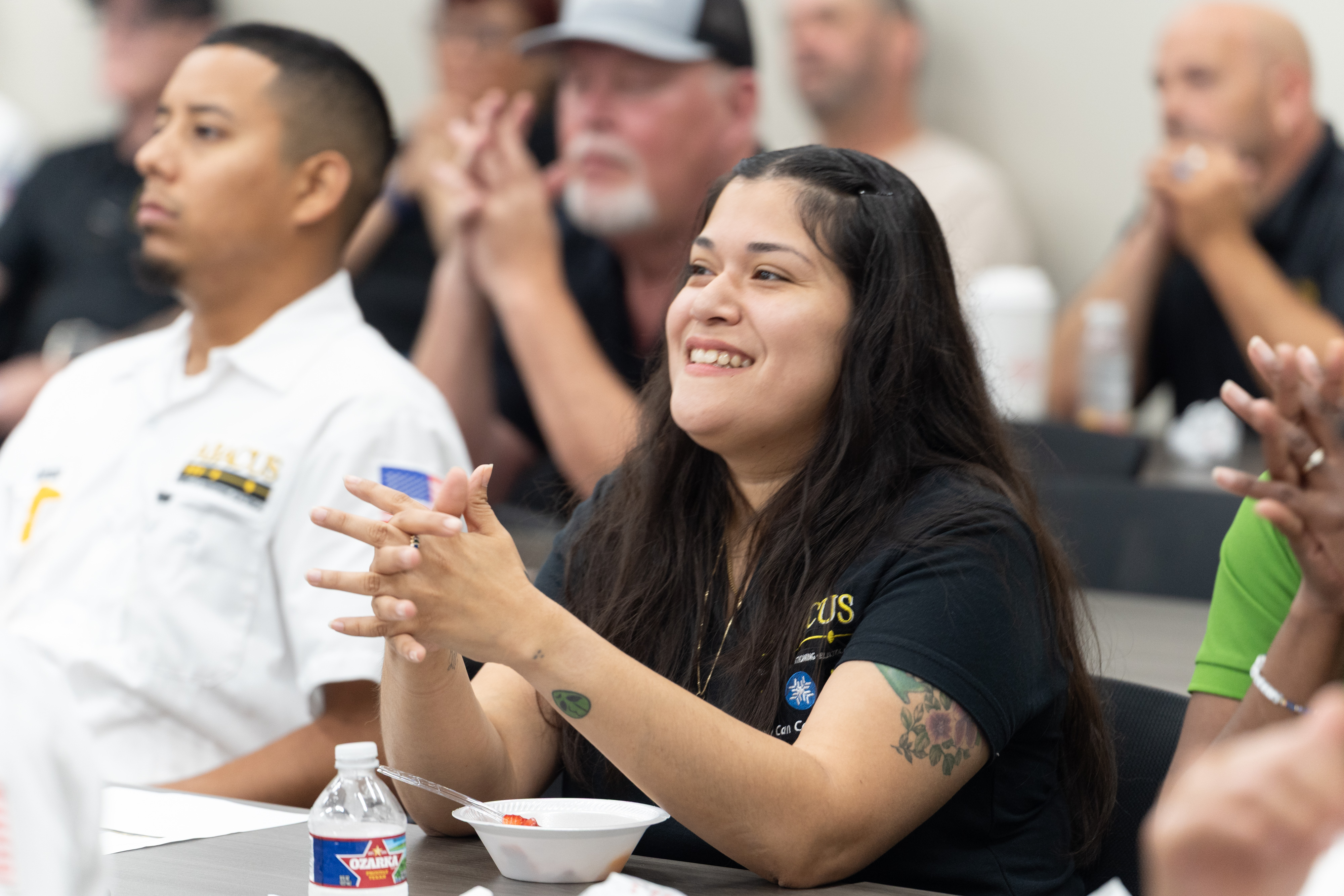Abacus Plumbing, Air Conditioning, & Electrical showcases a welcoming, trained team member engaging confidently in a company training session to build trust.