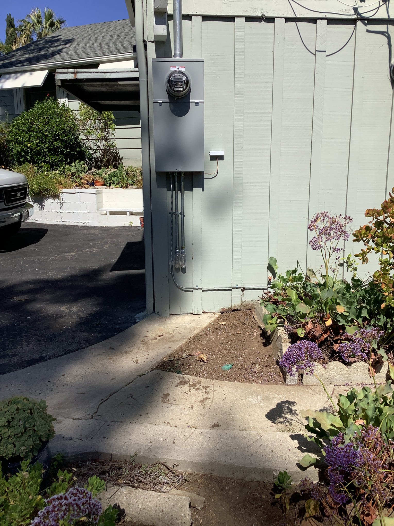 Powell Electric installed a clean, code-conscious meter and conduit that enhance home safety and curb appeal.