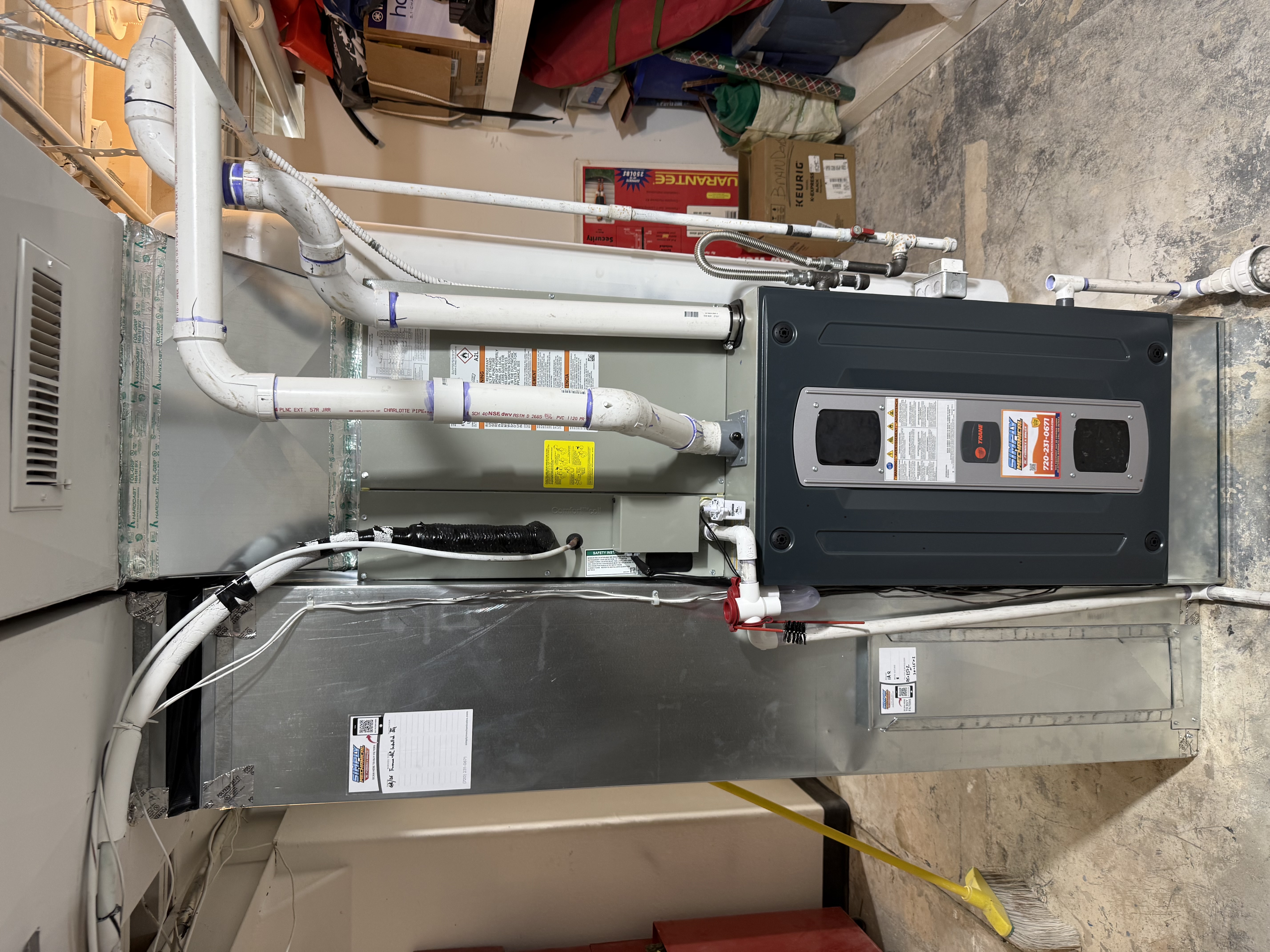 A tidy, professionally installed air handler and drain system shows the dependable craftsmanship customers expect from Simply Mechanical AC, Furnace & Boiler Repair.