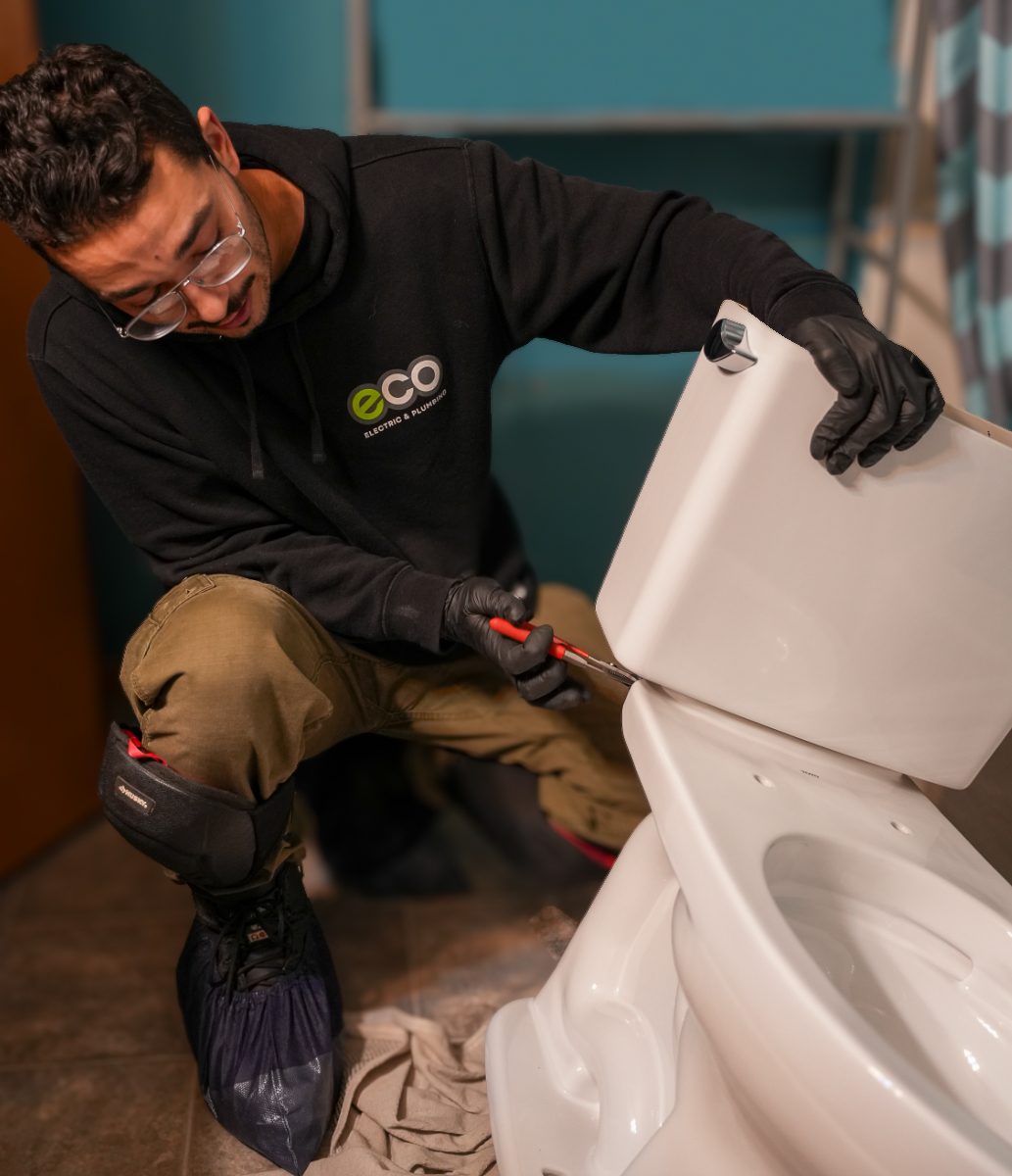 Eco Electric, Plumbing, Heating and Air shows attentive plumbing service and clean workmanship while replacing a toilet tank for homeowner peace of mind.