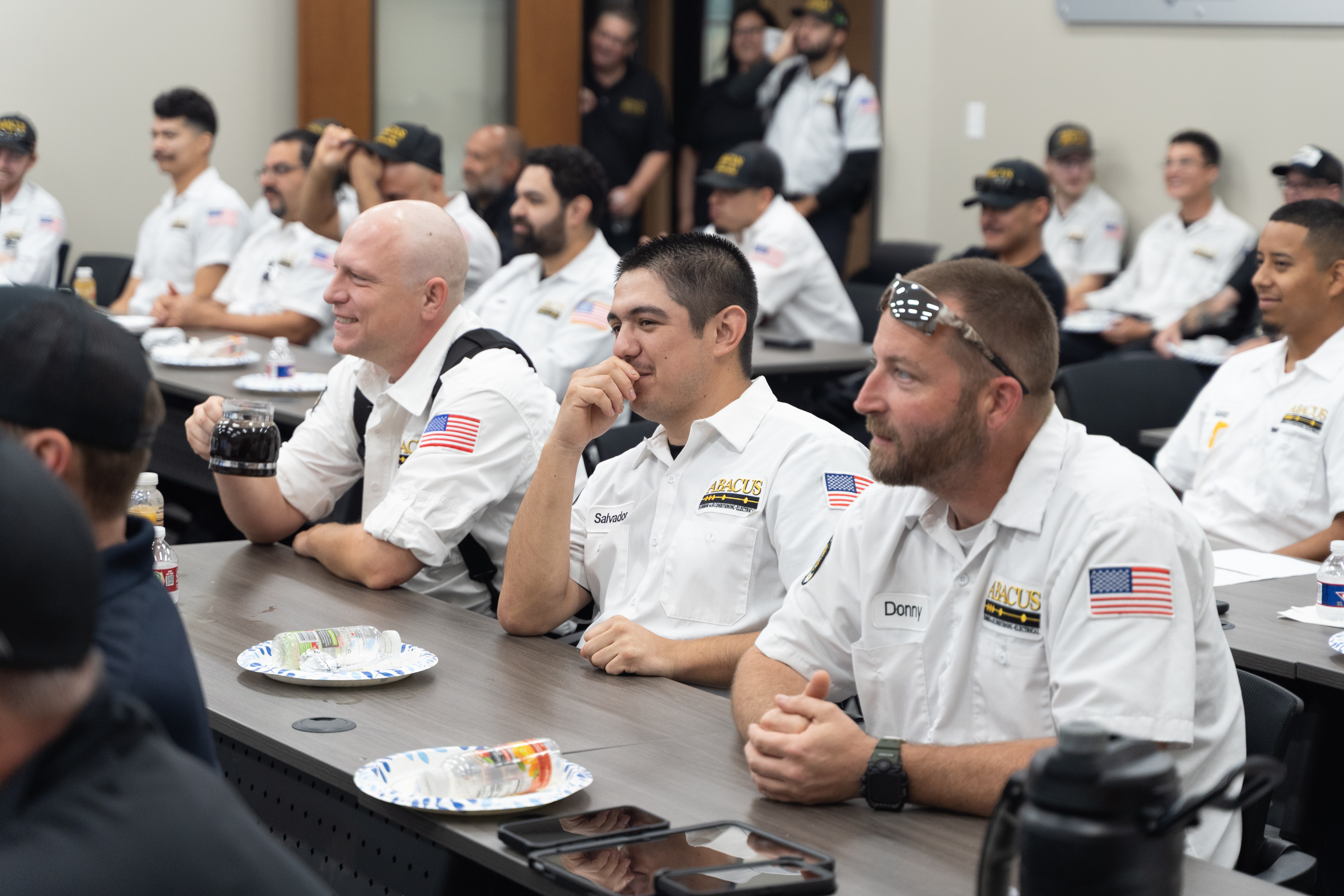 Team members gathered for training show the professionalism and care Abacus Plumbing, Air Conditioning, & Electrical brings to every job.