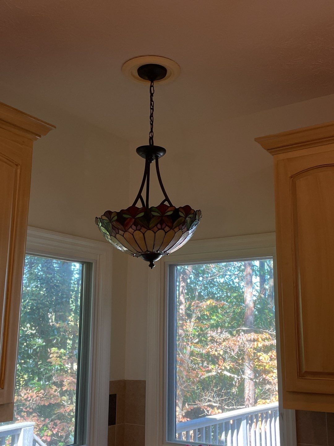A beautifully installed stained-glass fixture brings warm character and reliable lighting to homes, proudly installed by C&T Electric LLC.