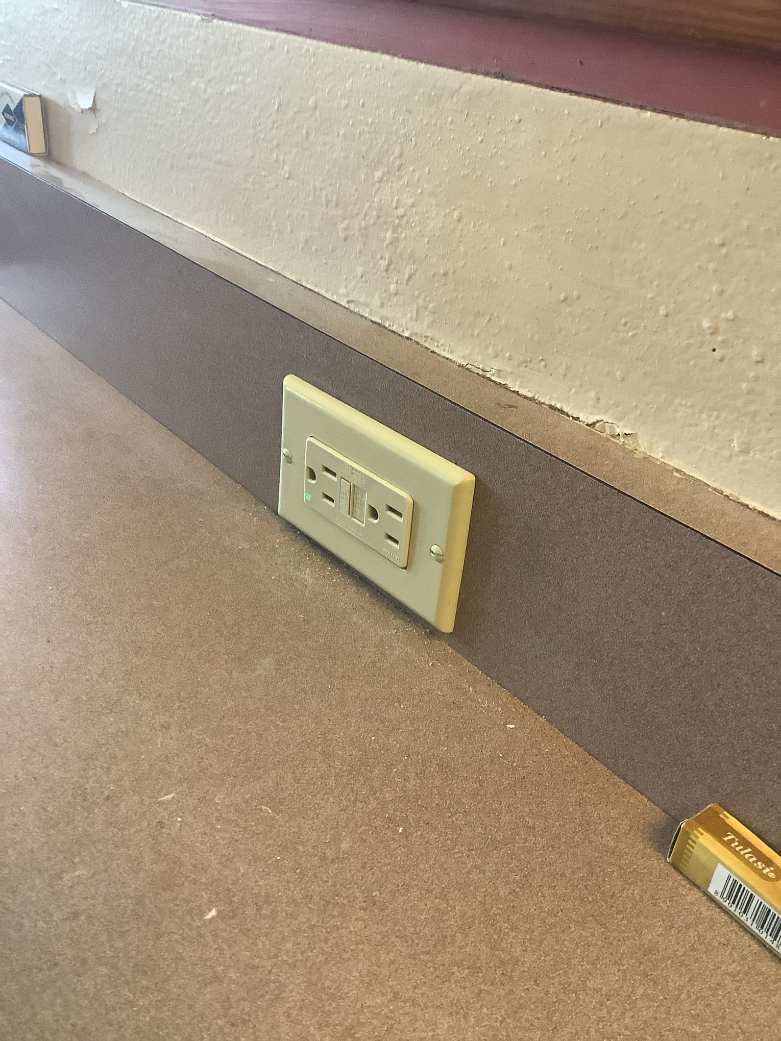 Powell Electric ensures safe and reliable outlet installations while keeping work areas neat and addressing visible wall repair needs.
