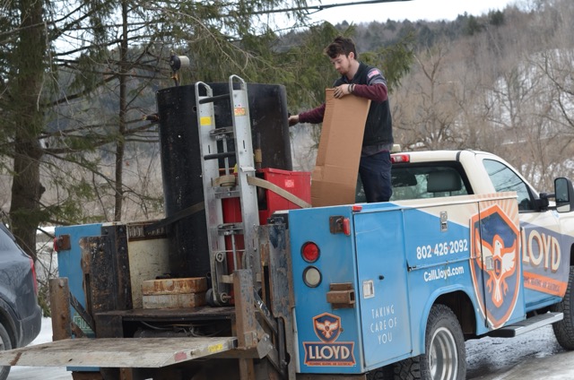 A skilled Lloyd Plumbing, Heating, Air, Electrical technician handles on-site equipment with care, showing dependable service even in cold conditions.