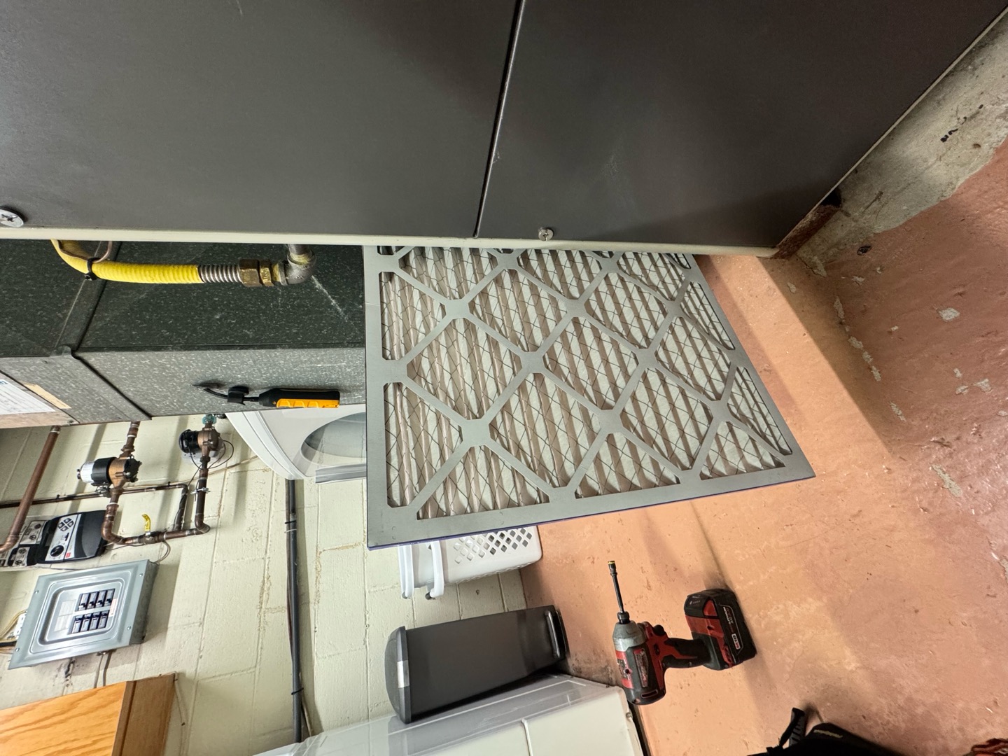 Routine maintenance ensures reliable comfort, and Boehmer Heating & Cooling shows professional care with visible filter servicing.