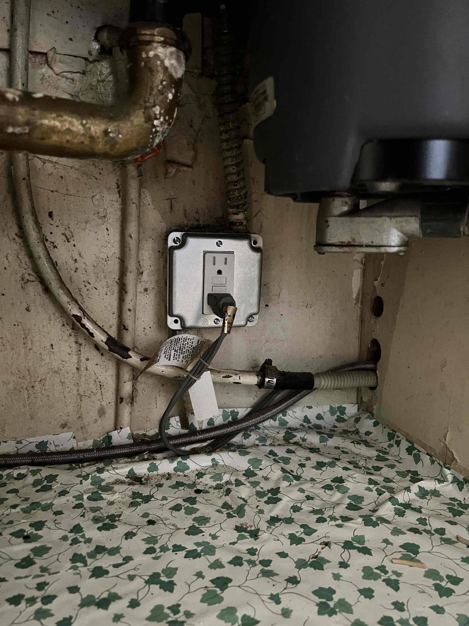 Powell Electric ensures safe under-sink electrical protection with a properly installed GFCI outlet, giving homeowners reliable peace of mind.