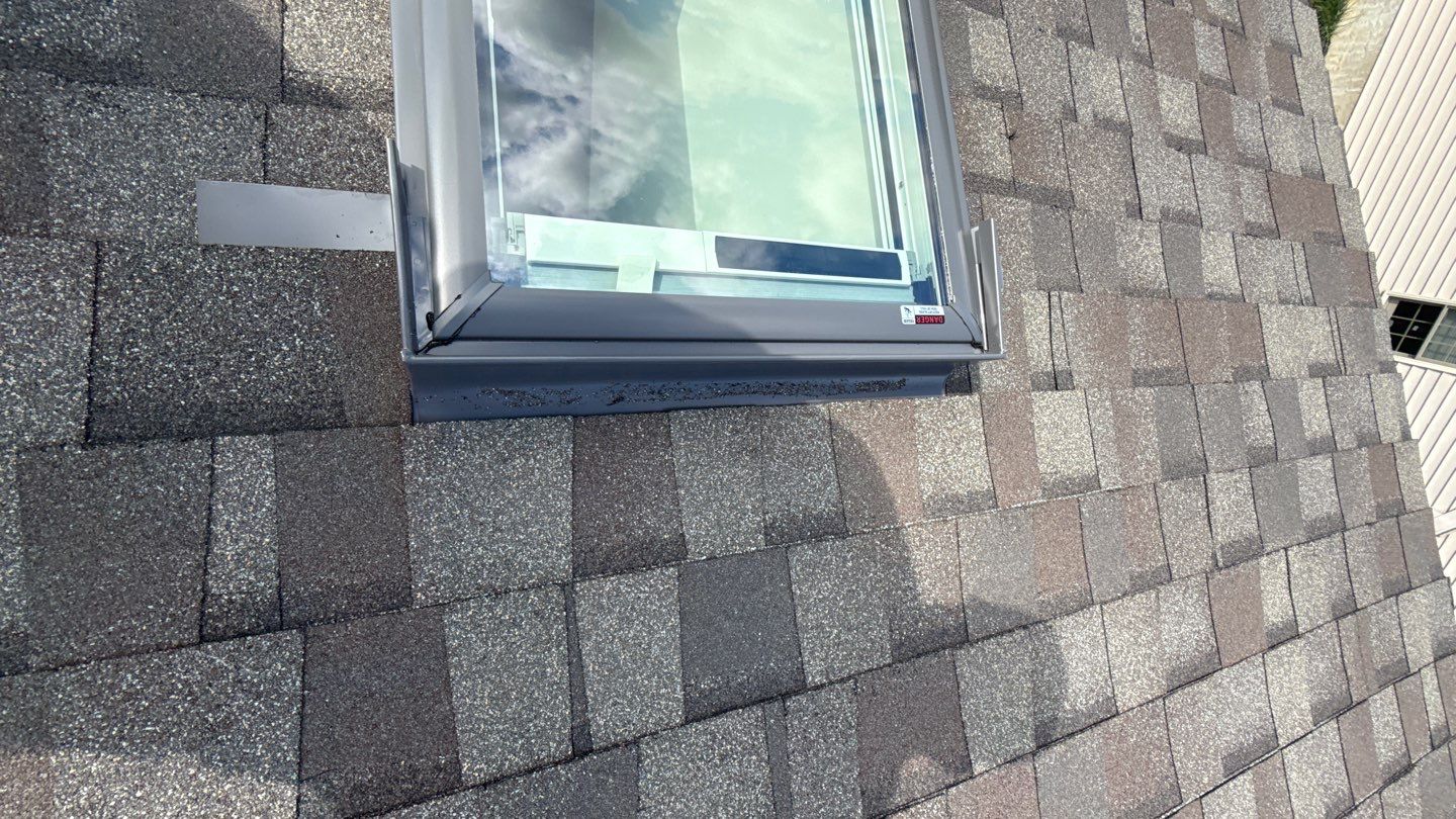A precision skylight installation by Mosaic Roofing & Exteriors highlights durable flashing and neat shingle work for long lasting protection.