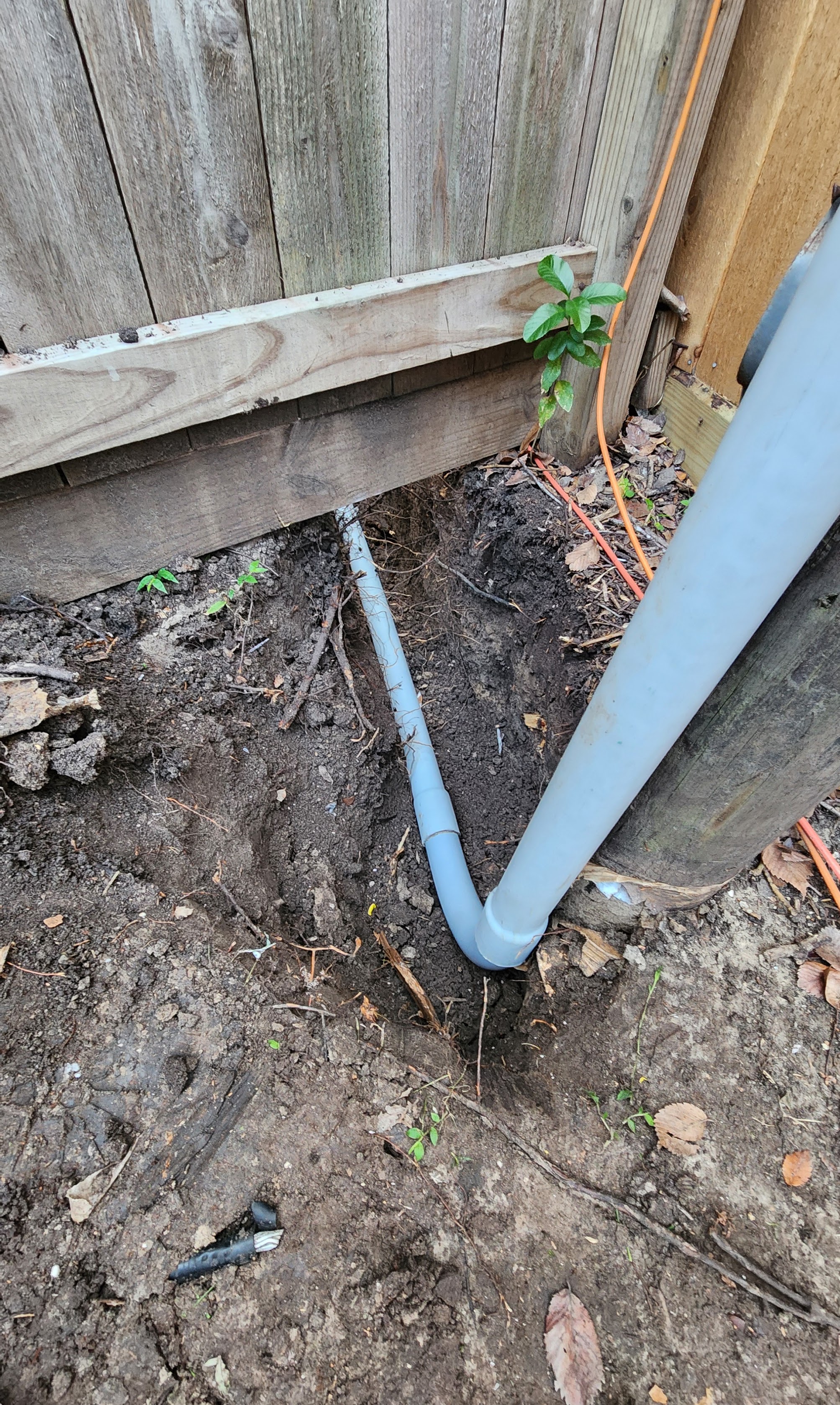 Reliable, neat pipe installation alongside a fence shows the craftsmanship customers trust from Abacus Plumbing, Air Conditioning & Electrical.