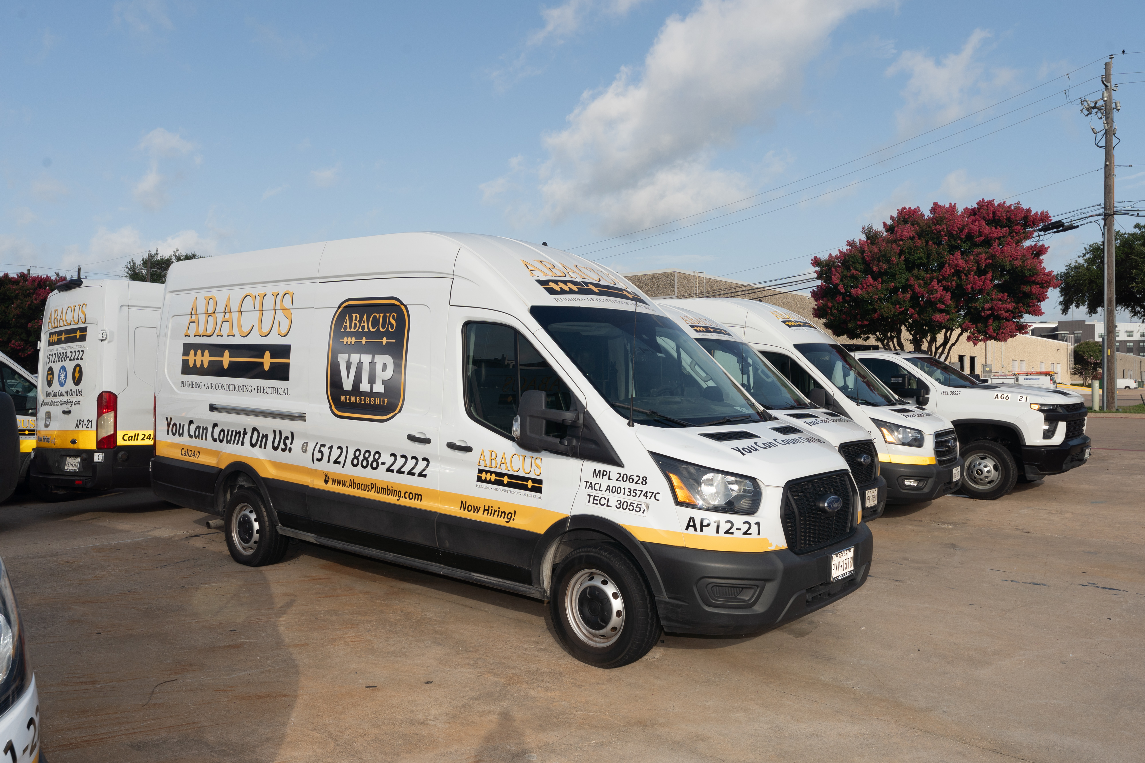 A ready fleet from Abacus Plumbing, Air Conditioning, & Electrical showcases professional reliability and fast response when you need service.