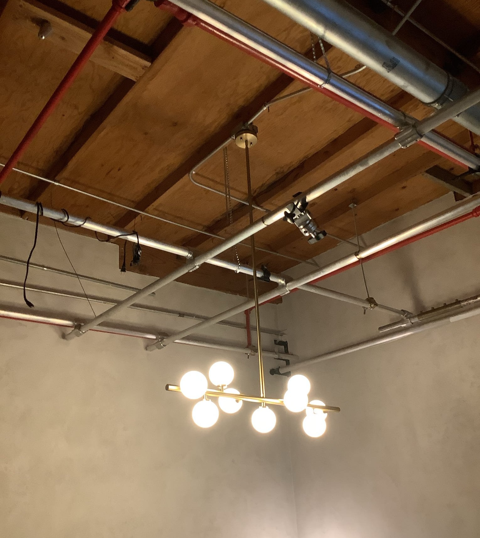 Powell Electric delivered a clean, professional ceiling installation that pairs exposed conduit with a polished pendant for reliable, attractive lighting.