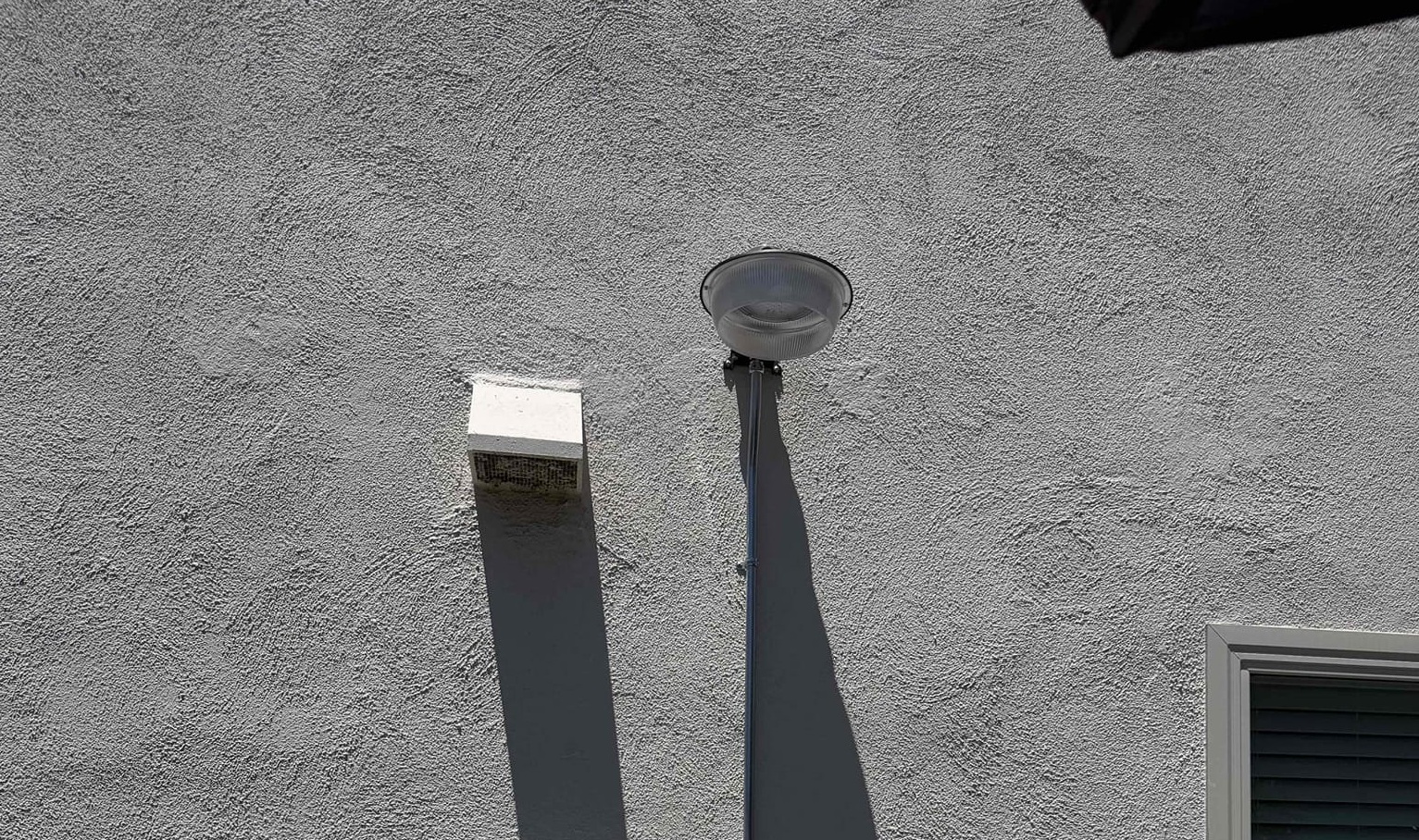Powell Electric showcases precise exterior lighting installation and tidy conduit work that enhances safety and curb appeal for homeowners.