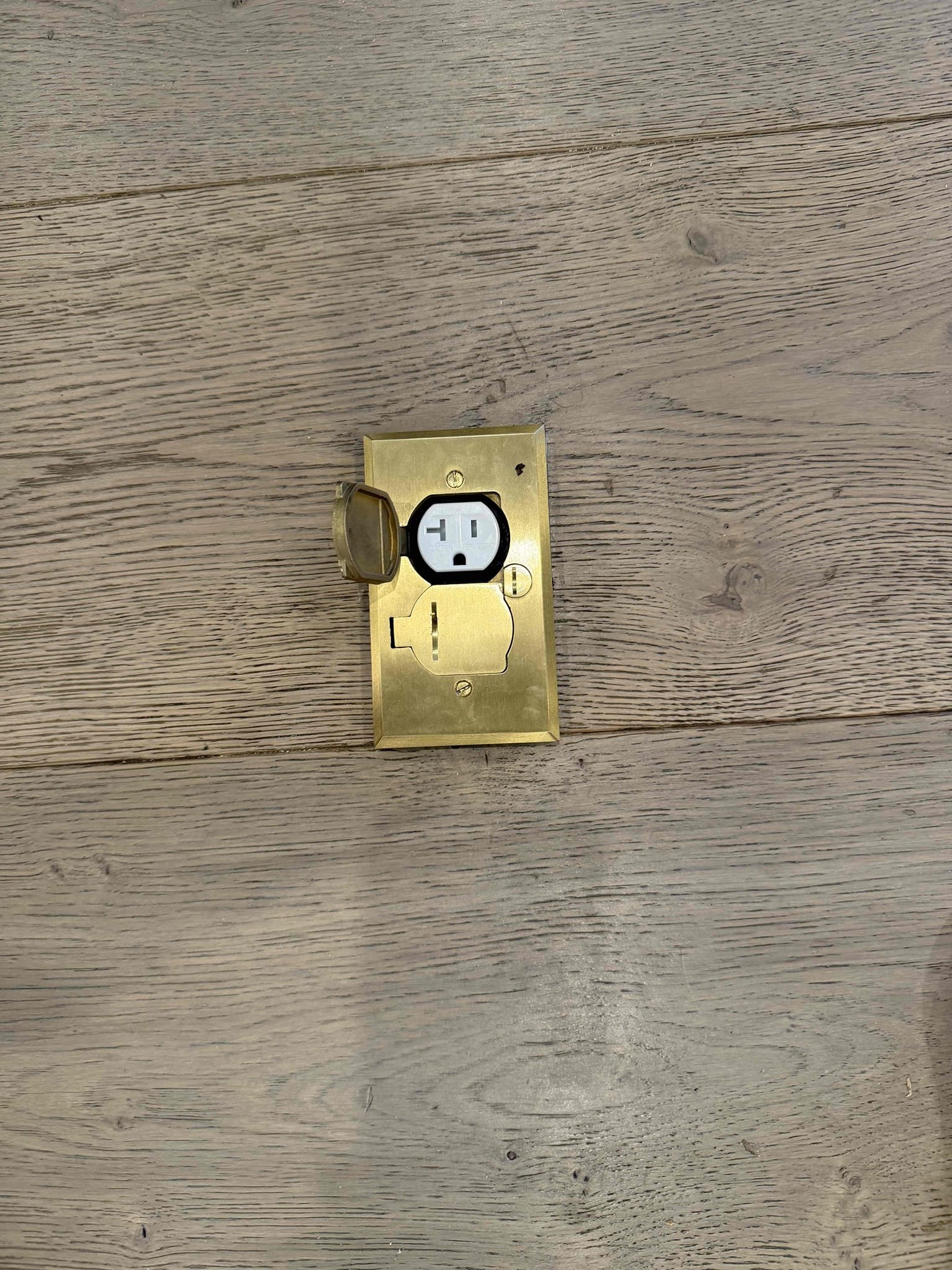 Powell Electric installs discreet, high-quality recessed outlets that blend with hardwood floors while ensuring safe, reliable power access.