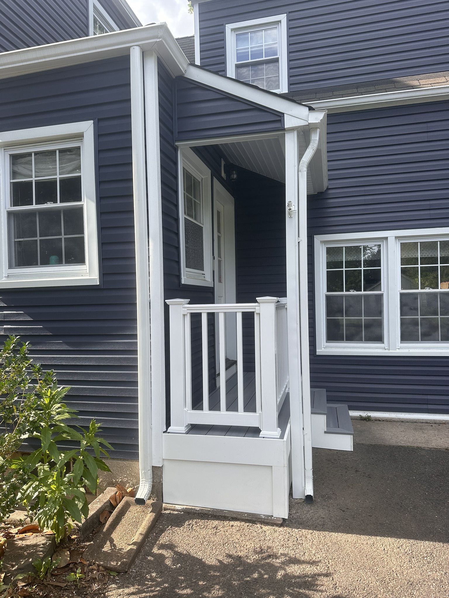 Enhance your home's curb appeal with A. Brooks Construction, Inc. Kanga Roof's expert siding and entryway installations.