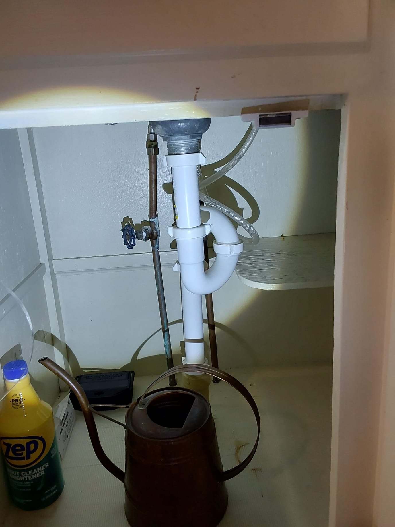 Spotless under-sink plumbing for reliable performance, courtesy of [Business Name].