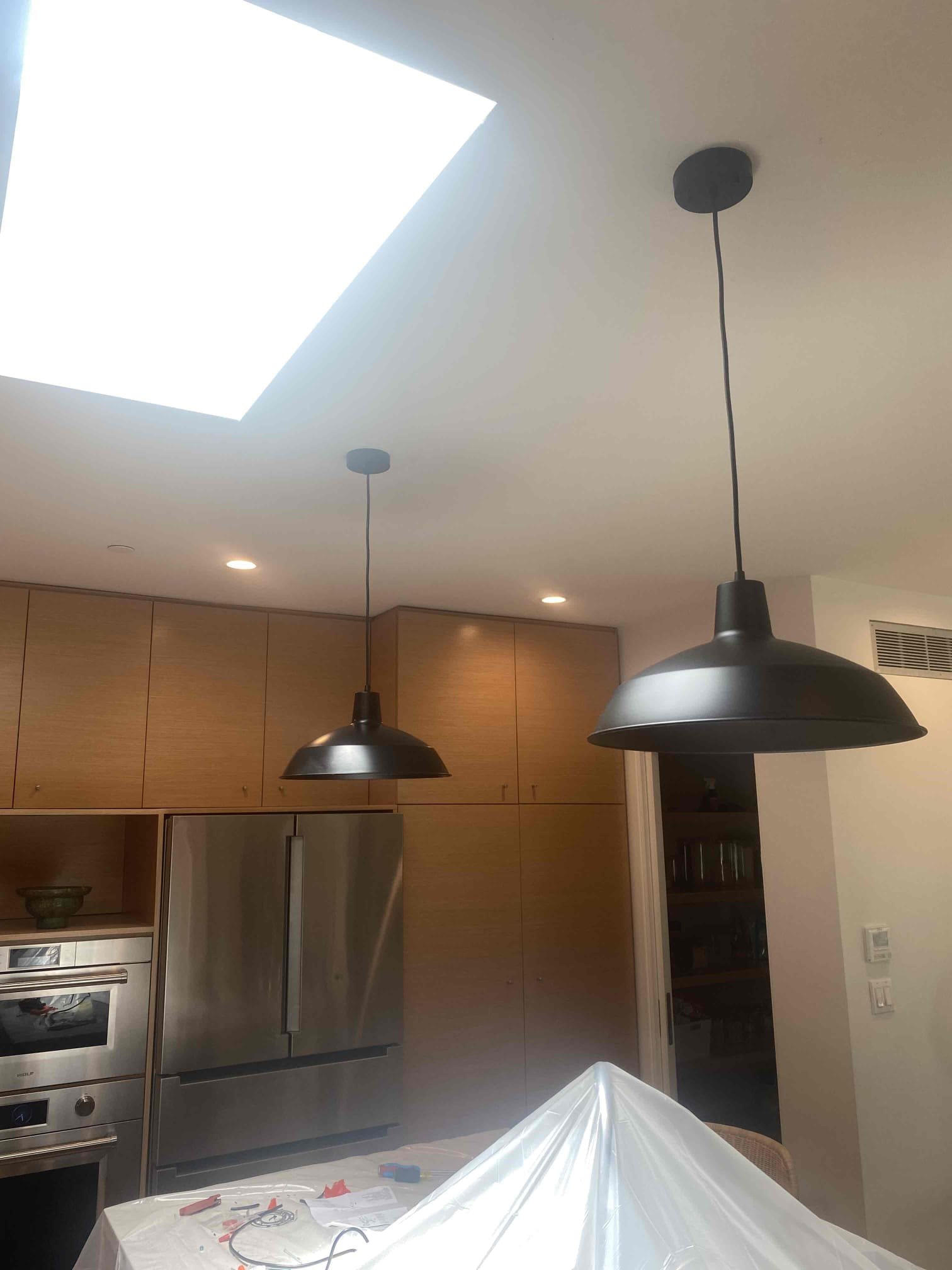Powell Electric delivered clean, careful lighting installation that enhances kitchen style while protecting your space during the work.