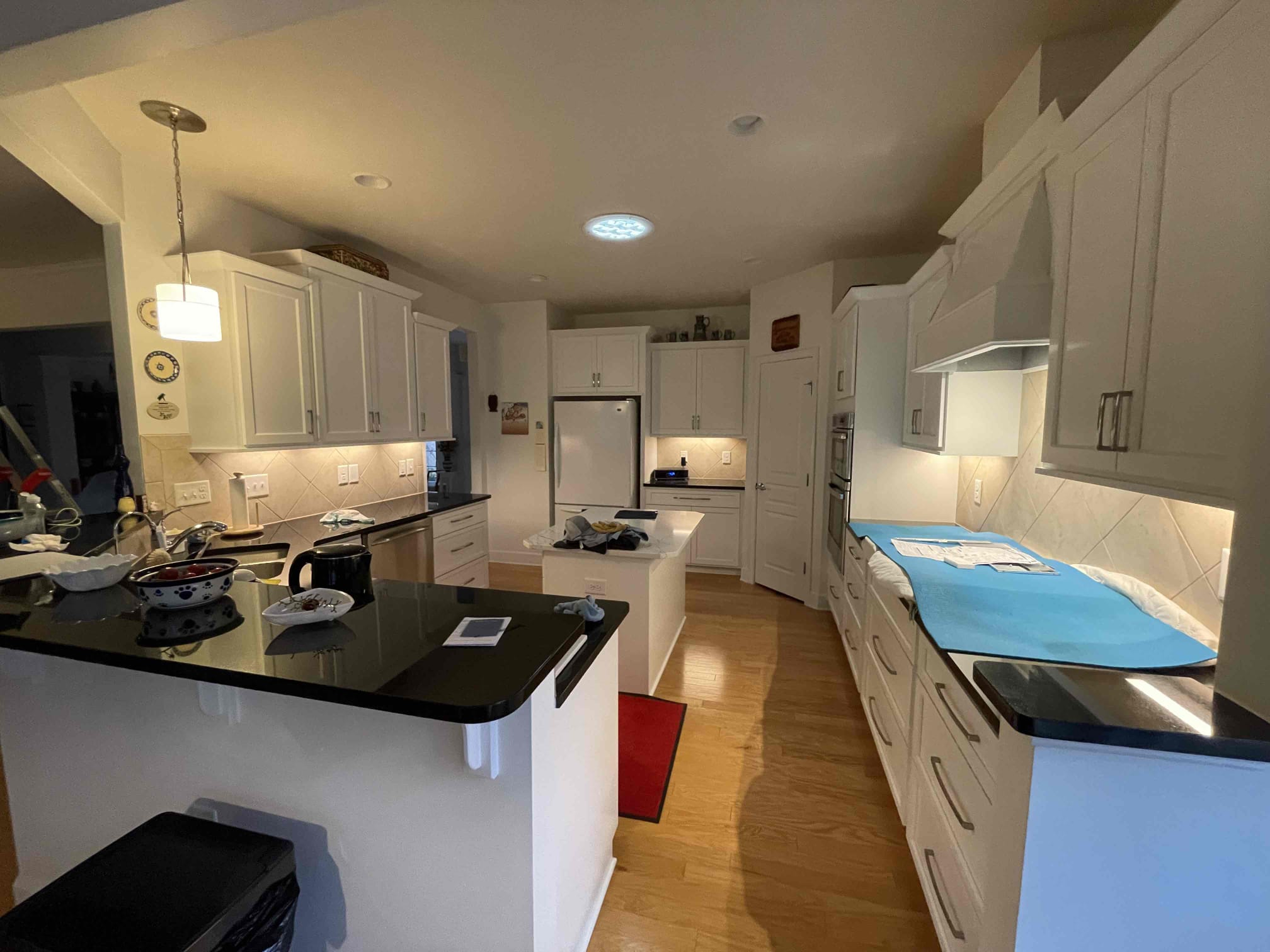 Reliable and tidy installations from Dawson's Electric & Air keep your kitchen bright and protected while showcasing professional craftsmanship.