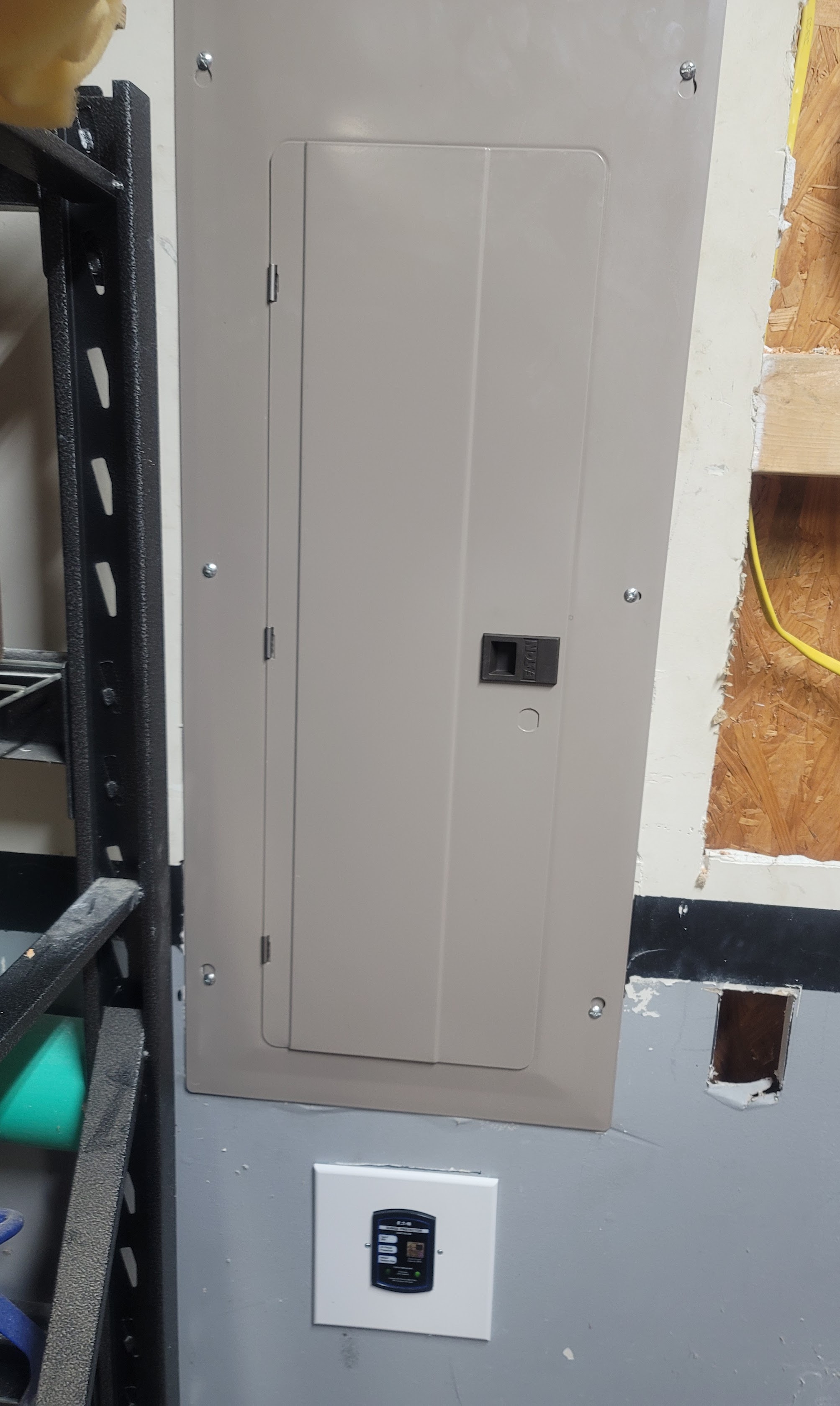 A cleanly installed electrical panel and monitoring device highlight the reliable workmanship customers expect from Abacus Plumbing, Air Conditioning & Electrical.
