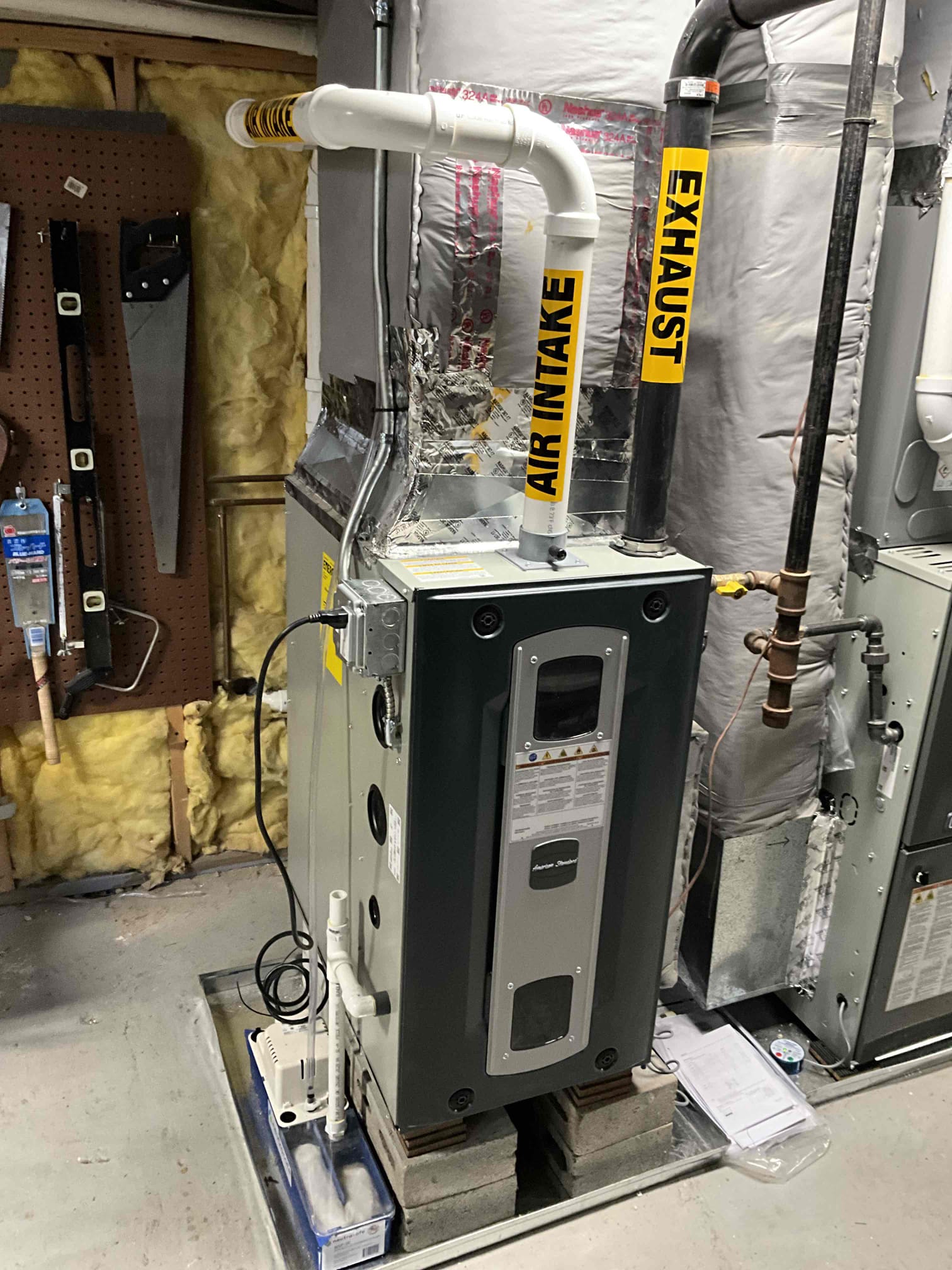 A clean, code-conscious installation highlights Akian Plumbing, Heating, Cooling & Electric's commitment to safe, reliable HVAC workmanship.