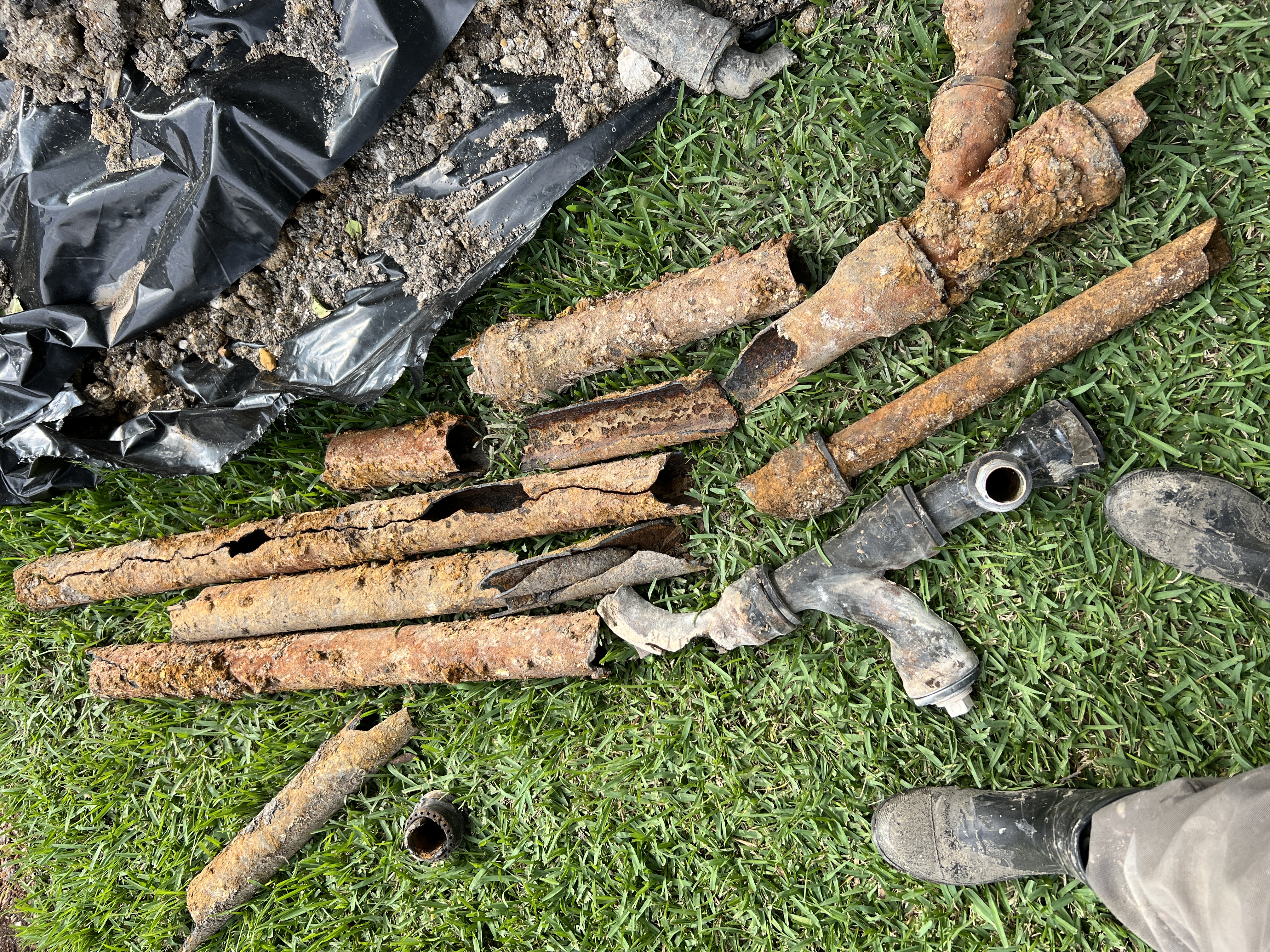Showing clear before and after results, Rise Plumbing Systems replaces heavily corroded underground pipes to restore reliable water flow.