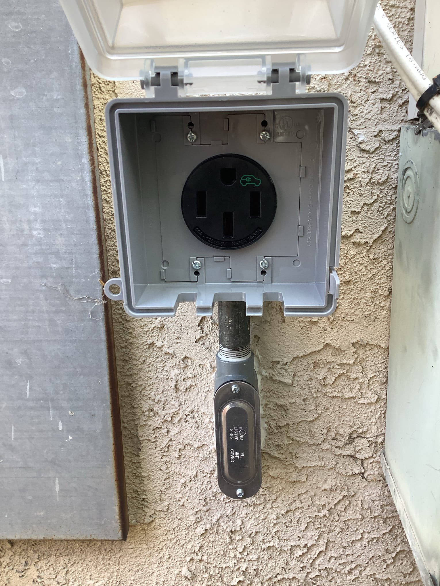 Powell Electric installed a weatherproof EV-ready outlet with neat conduit work to give homeowners reliable, long-lasting charging access.