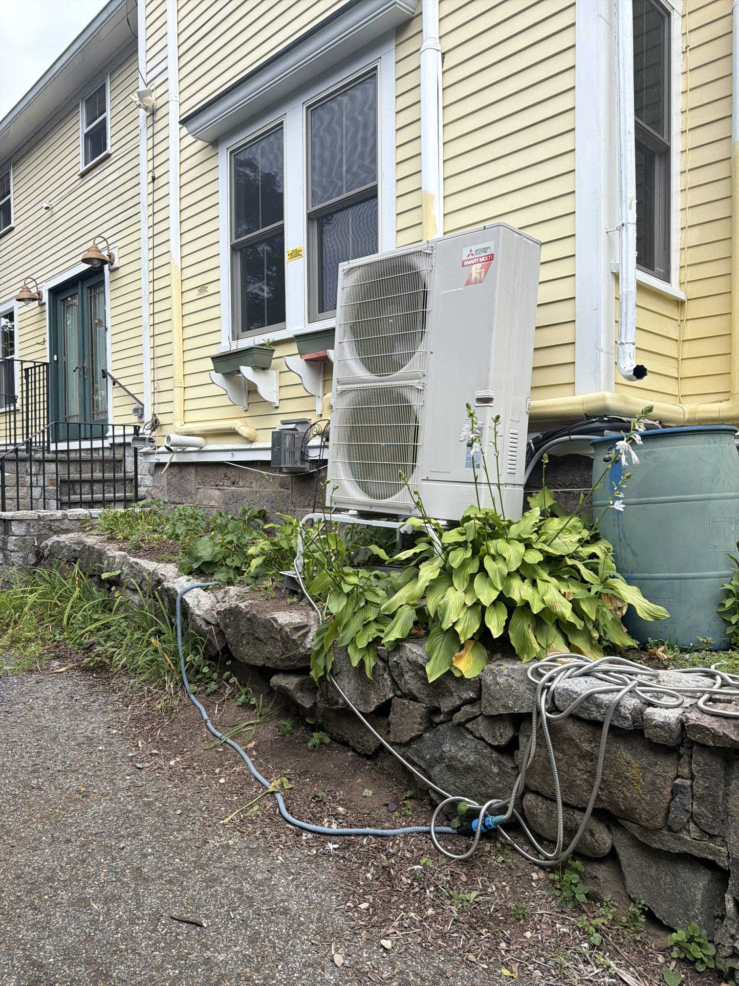 A clean, professionally installed outdoor heat pump unit enhances home comfort and reliability, confidently handled by Akian Plumbing, Heating, Cooling & Electric.