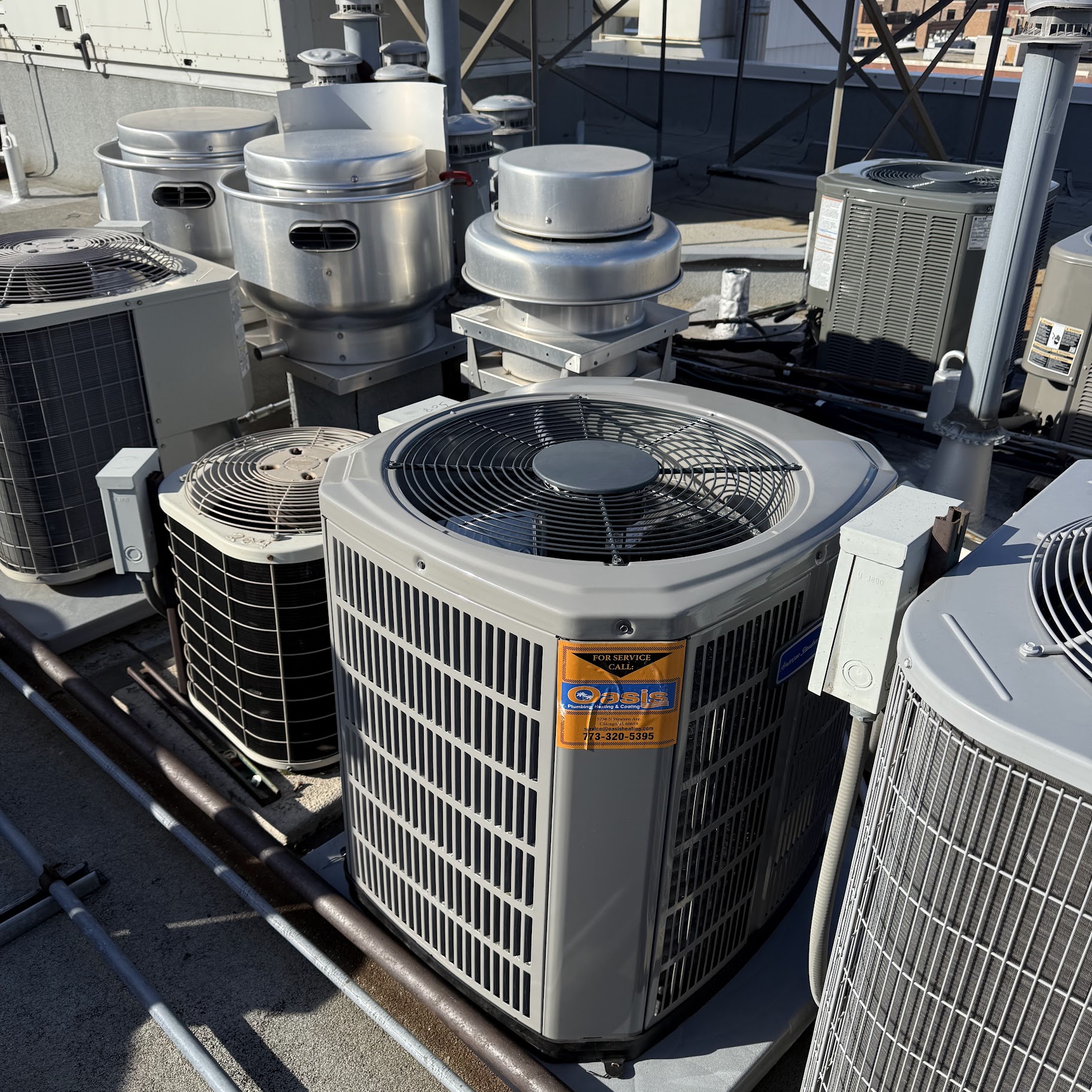 Skilled rooftop installations and tidy equipment access show Oasis Heating and Cooling's commitment to dependable, professional HVAC service.
