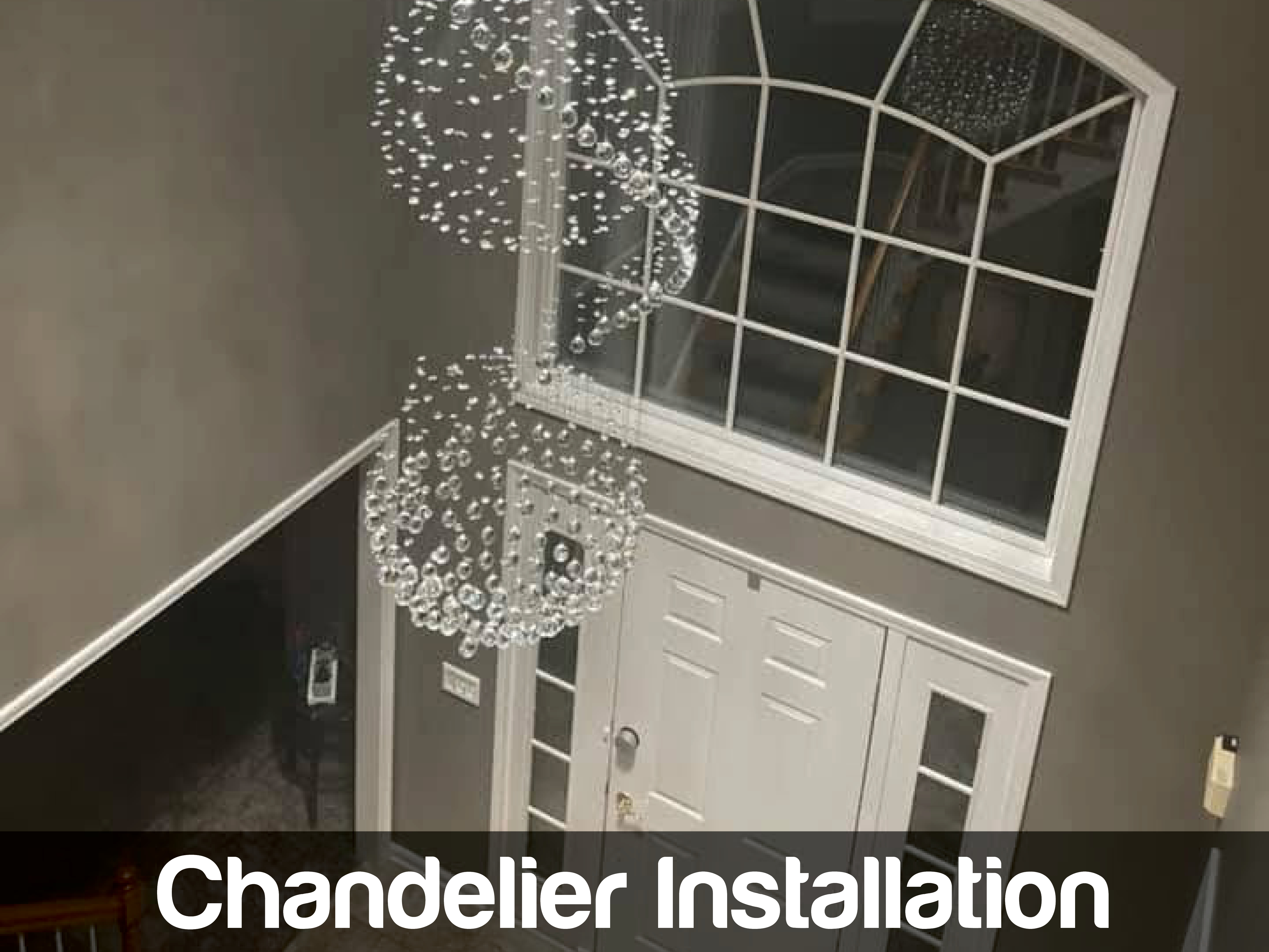 Freshly installed chandelier adds a polished, welcoming touch to this entryway, showing Doctor Electric's commitment to careful, high-quality work.