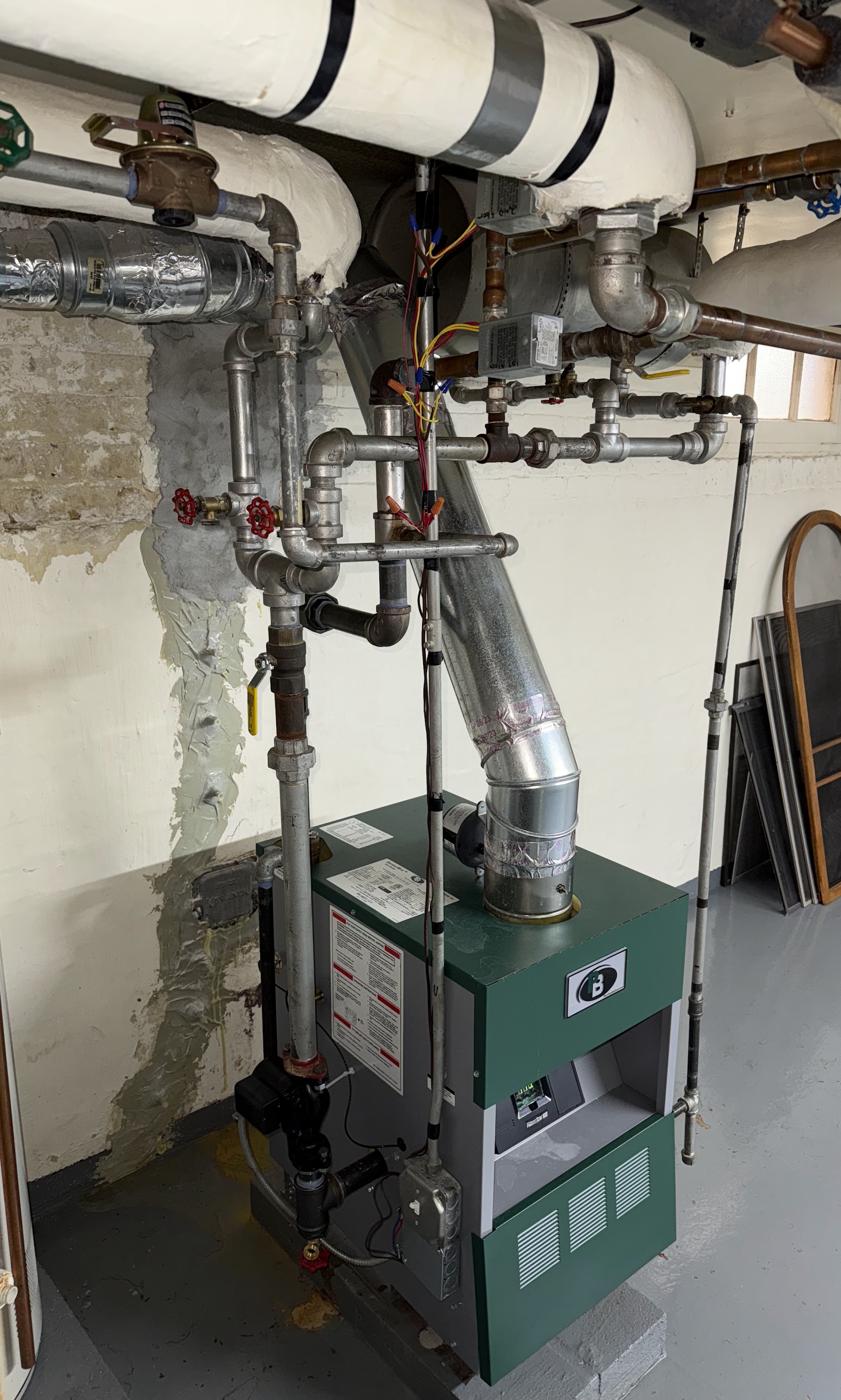 Reliable craftsmanship keeps homes comfortable and safe, as shown by Oasis Heating and Cooling's tidy boiler and serviceable piping.