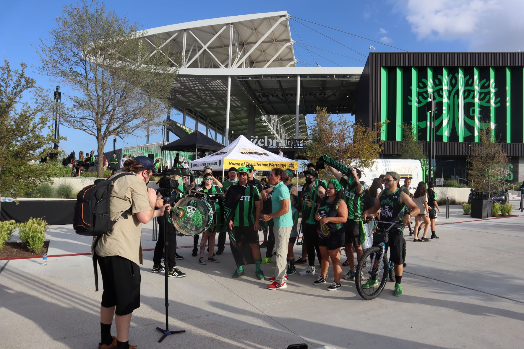 Cheerful community support at a local event highlights Abacus Plumbing, Air Conditioning, & Electrical's commitment to trusted neighborhood service.