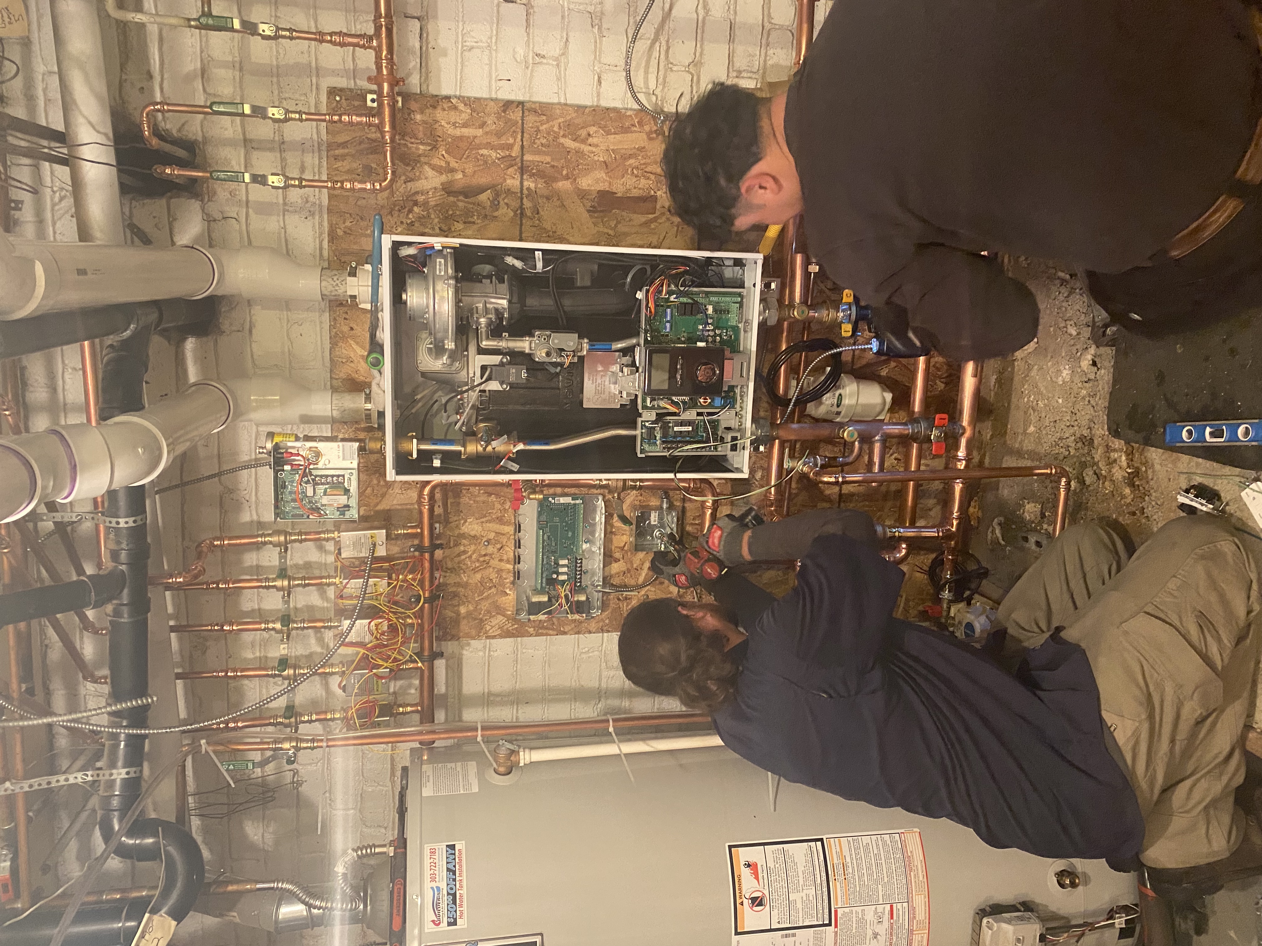 At Bell Plumbing, Heating, Cooling & Electrical, we ensure high-quality service, as showcased by our expert technicians meticulously managing complex systems to perfection.