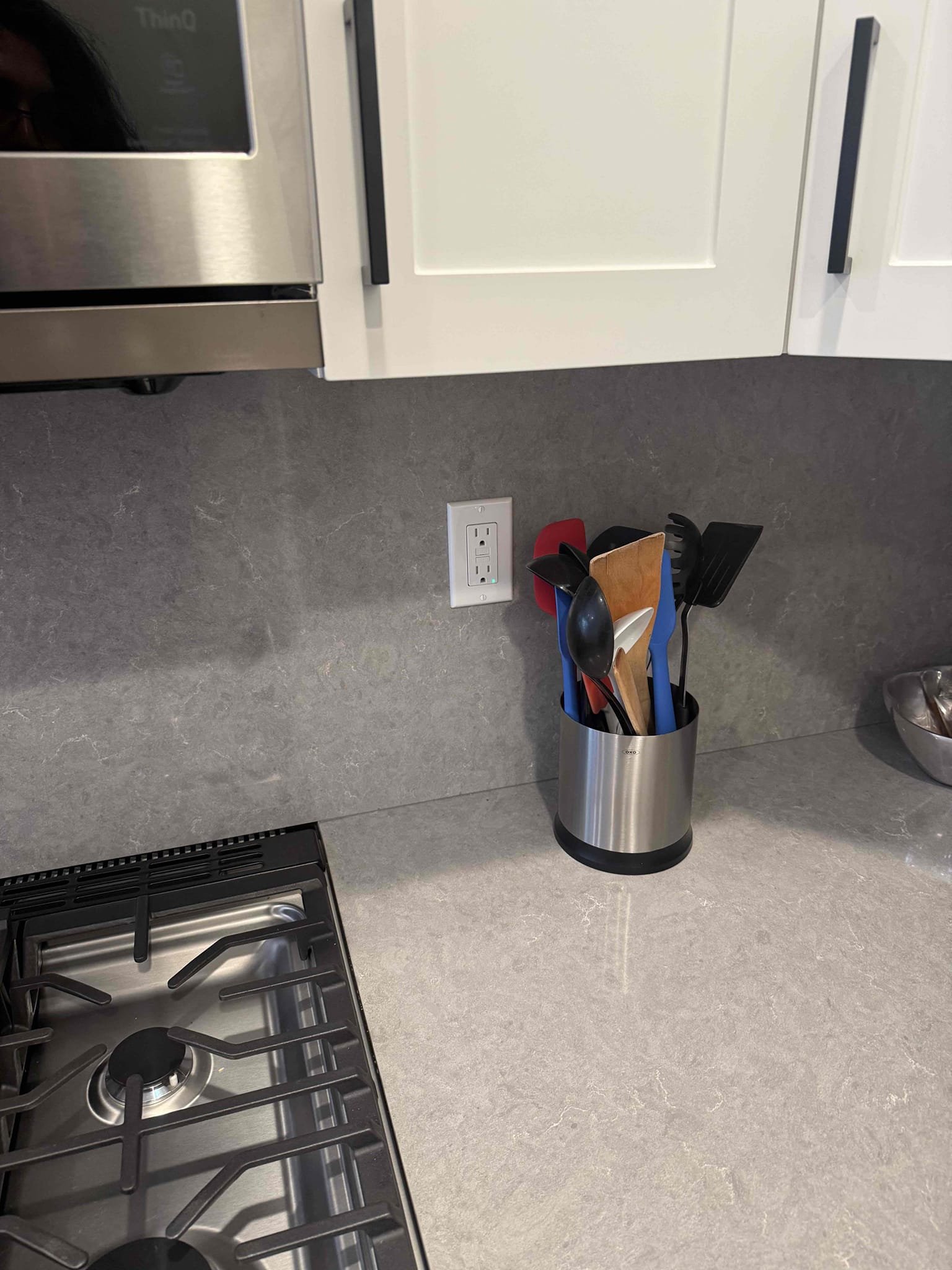 Powell Electric expertly installed a clean, safe kitchen outlet that blends with modern cabinetry and finishes.