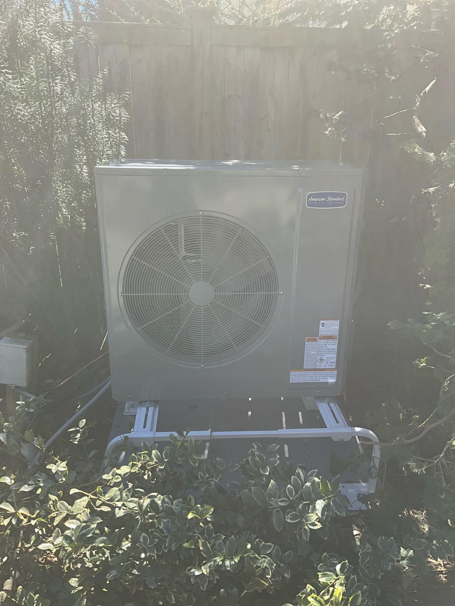 Reliable installation and clear labeling show the care Akian Plumbing, Heating, Cooling & Electric brings to every outdoor HVAC setup, ensuring lasting performance.
