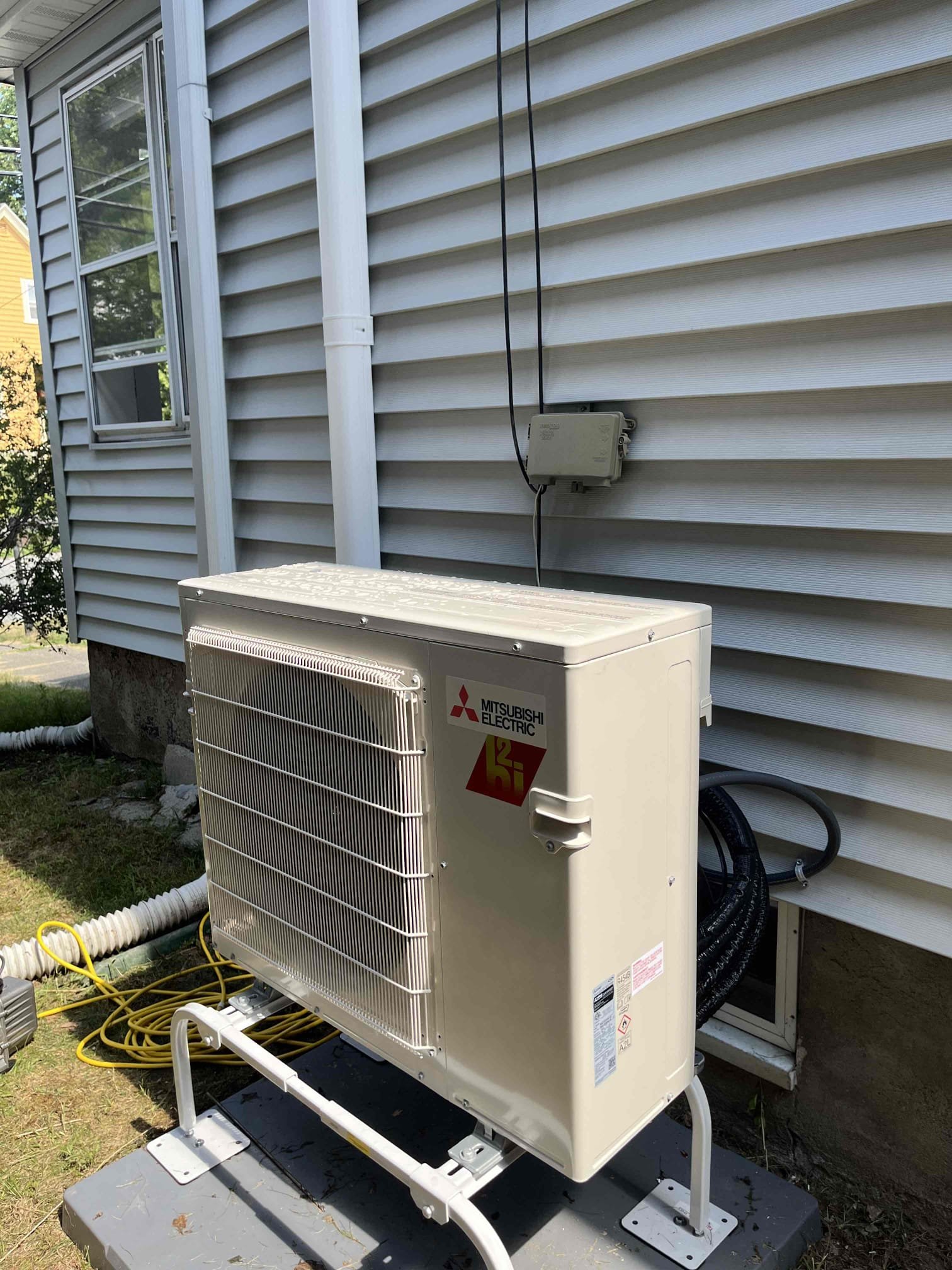 Cleanly installed Mitsubishi mini-split demonstrates the craftsmanship homeowners trust from Akian Plumbing, Heating, Cooling & Electric.