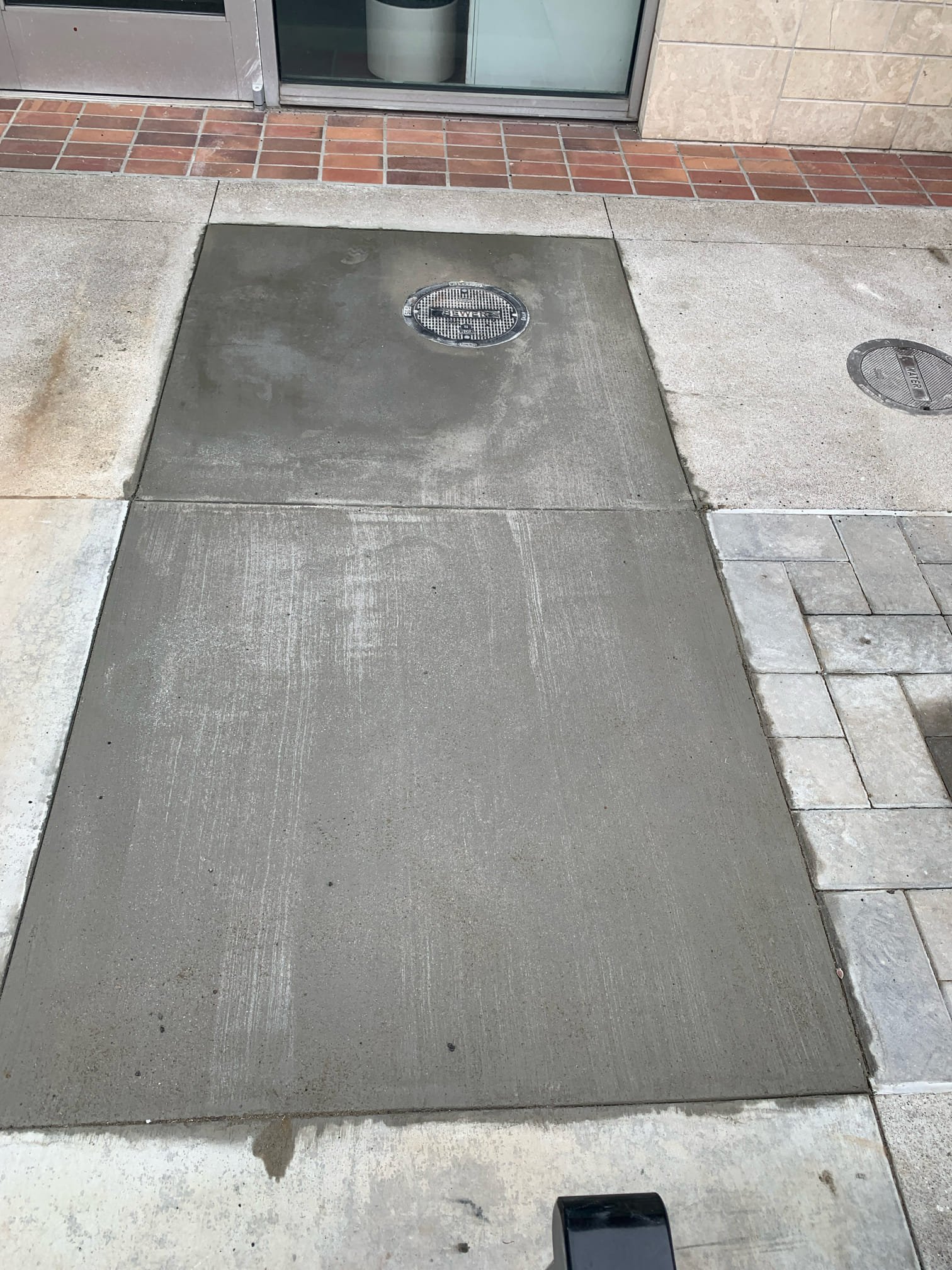 A clean, freshly finished concrete patch demonstrates the reliable workmanship customers count on from Magic Plumbing Heating & Cooling.