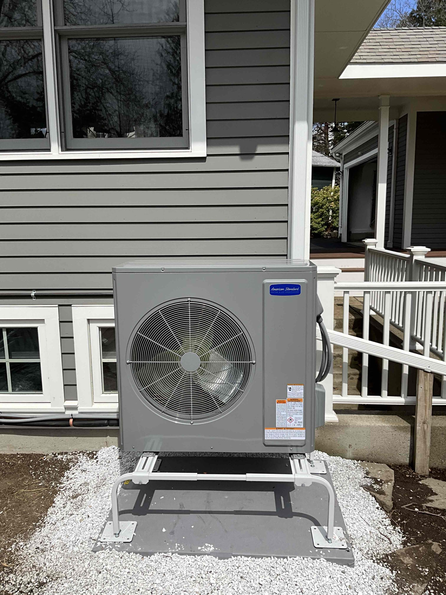 A tidy, professionally installed outdoor HVAC unit shows the care and craftsmanship customers expect from Akian Plumbing, Heating, Cooling & Electric.