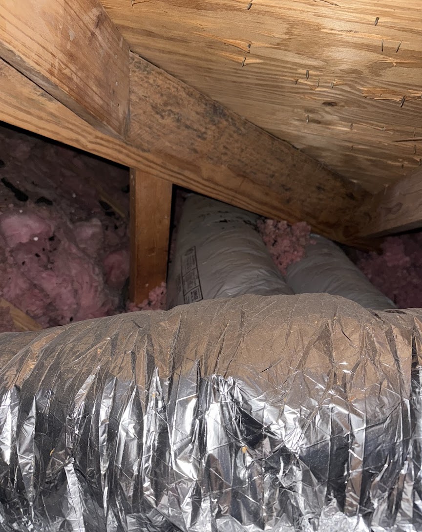 Professional attic ductwork and insulation demonstrate the efficient care Abacus Plumbing, Air Conditioning, & Electrical brings to home comfort and energy savings.