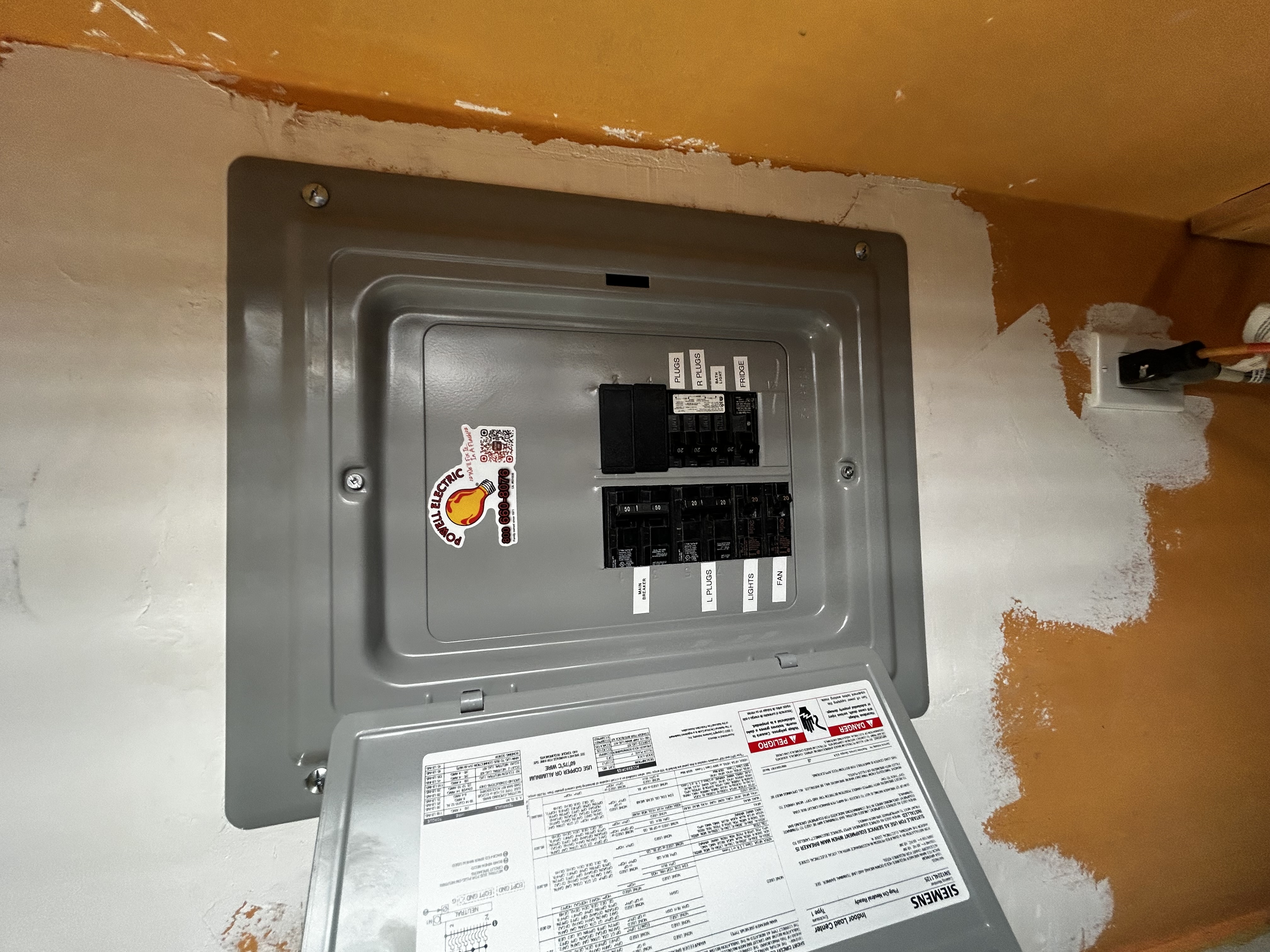 Powell Electric demonstrates reliable, careful electrical work with clearly labeled breakers and tidy panel installation for lasting safety.