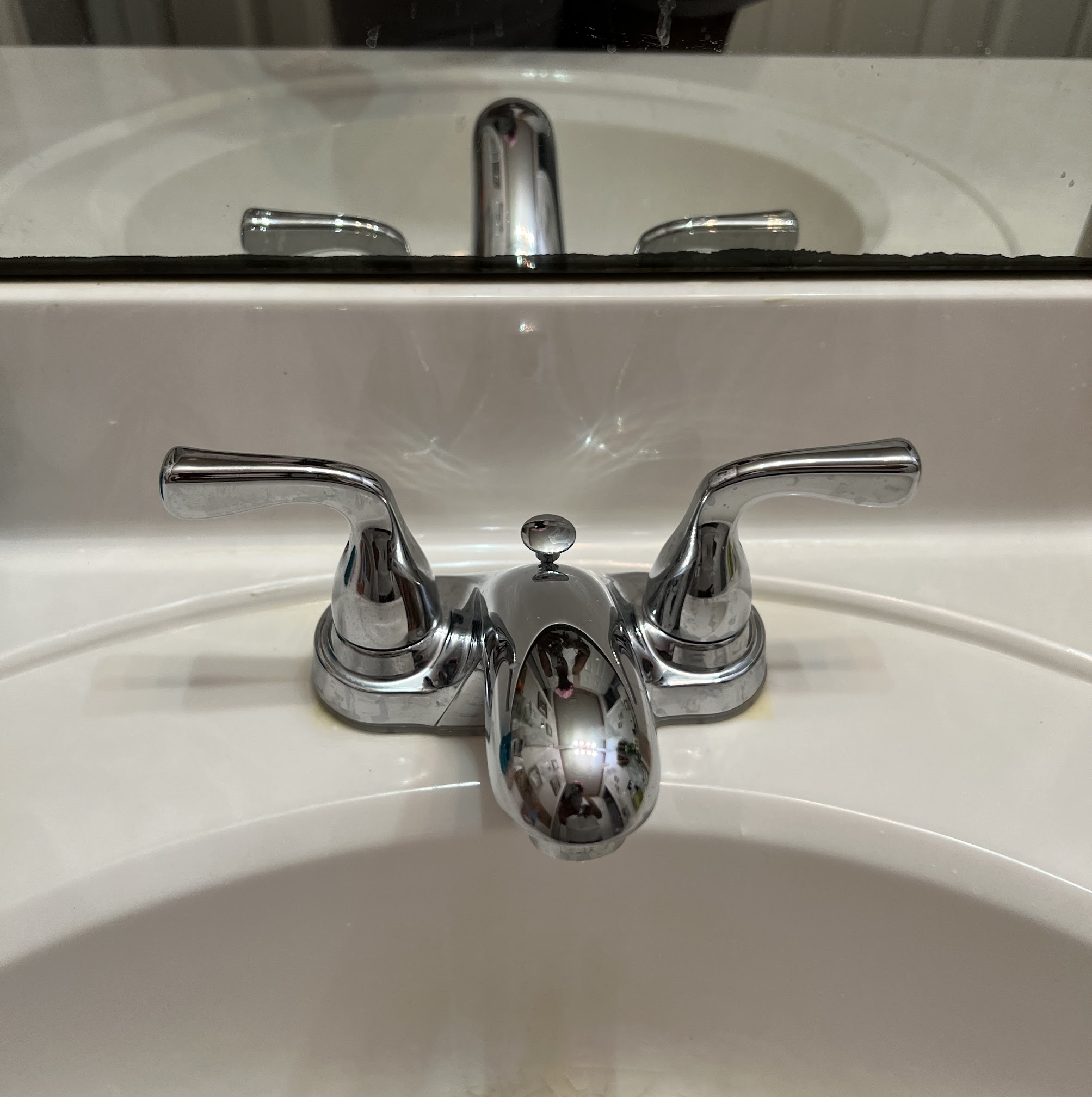 A clean, professionally installed chrome bathroom faucet highlights reliable workmanship from Abacus Plumbing, Air Conditioning & Electrical.