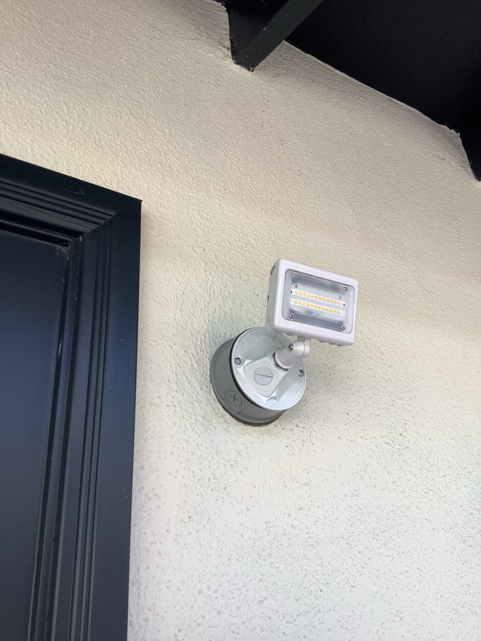 Powell Electric installed a clean, durable exterior LED fixture that enhances home safety and reliable nighttime lighting.