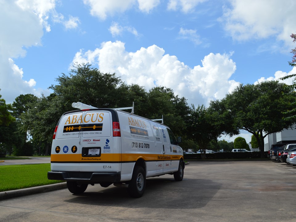 A clean, well-branded service van parked on site shows Abacus Plumbing, Air Conditioning & Electrical's professional reliability and trustworthiness.