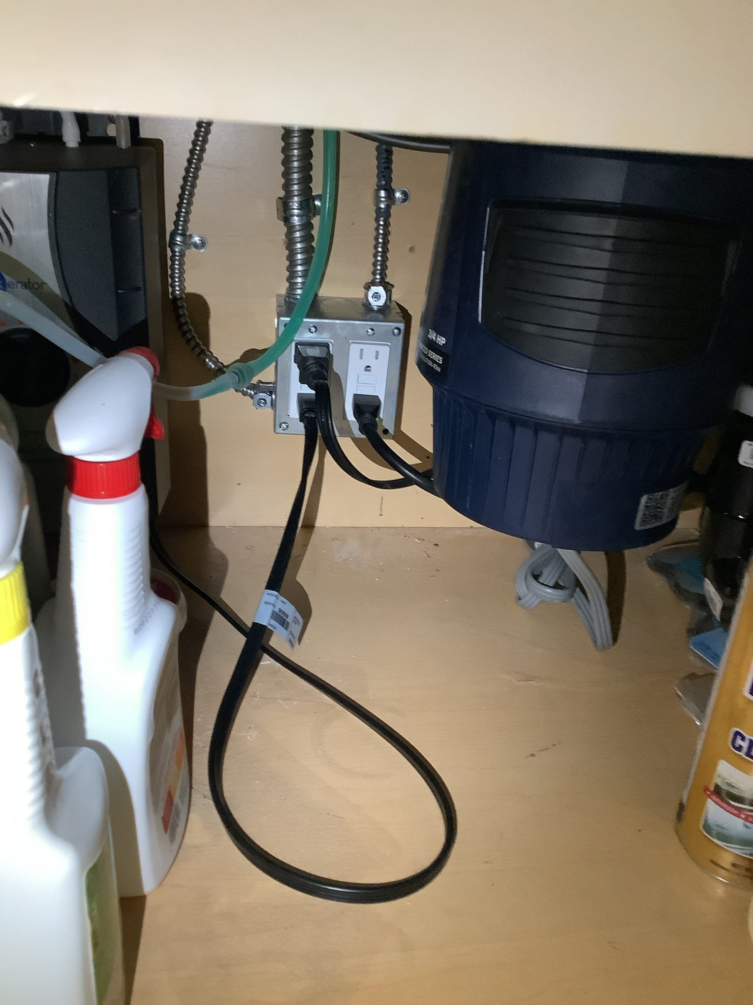 Powell Electric demonstrates careful, code-conscious under-sink wiring and clean installation that prioritizes safety and reliability for homeowners.